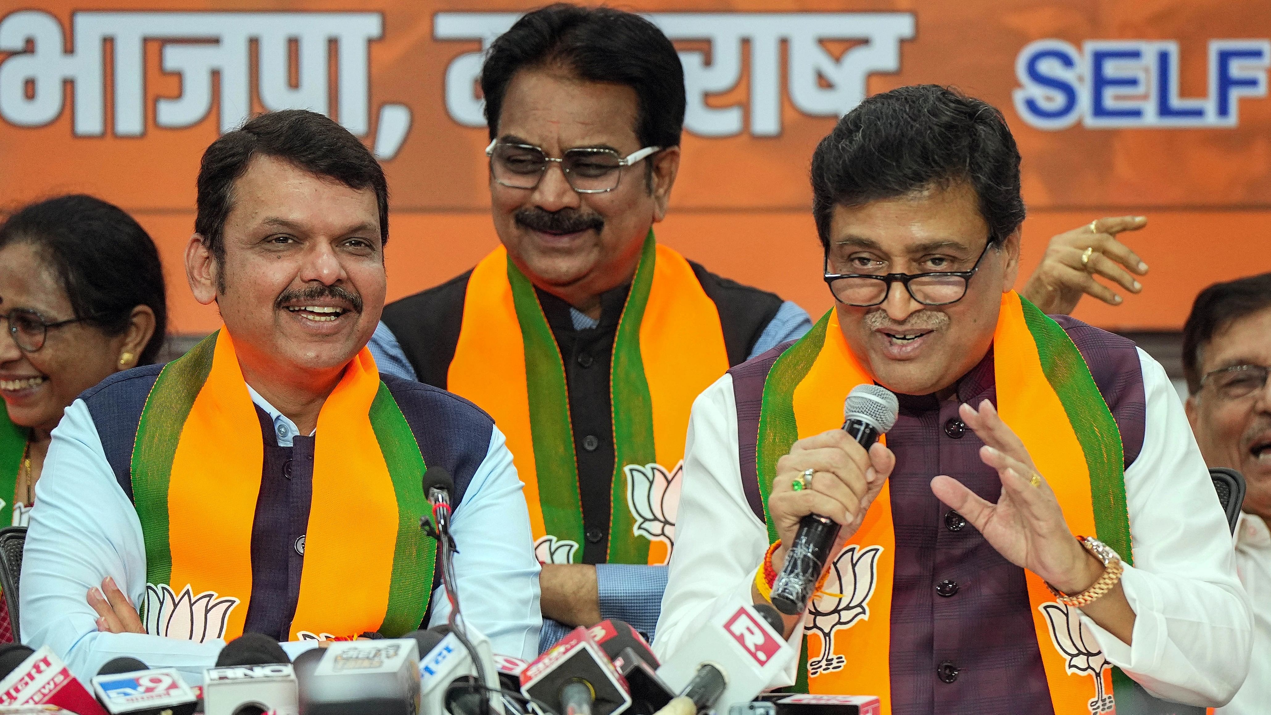 <div class="paragraphs"><p>Former Maharashtra CM and Congress leader Ashok Chavan with Maharashtra Deputy Chief Minister Devendra Fadnavis addresses media after joining BJP, in Mumbai, Tuesday, February 13, 2024. </p></div>