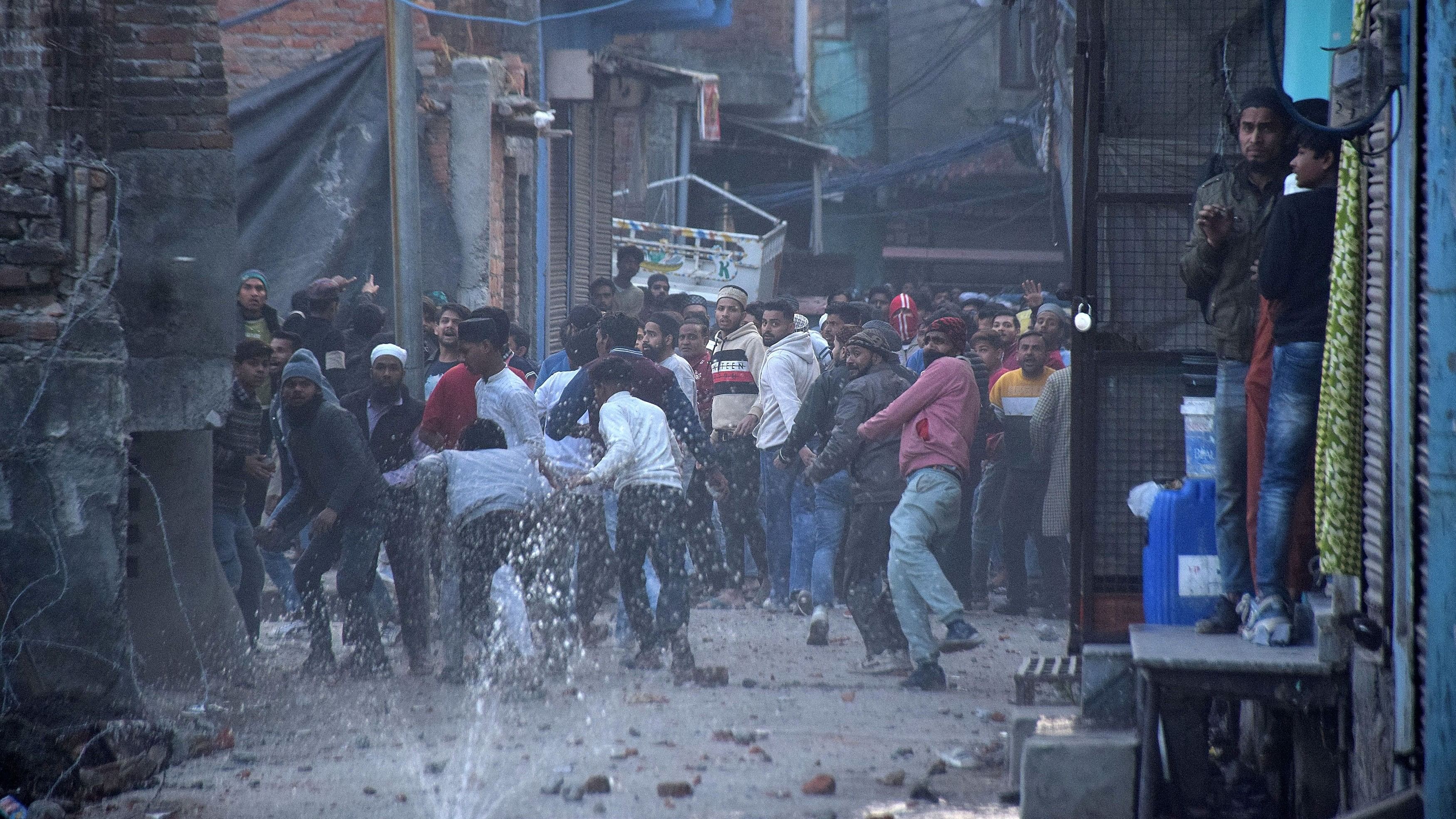 <div class="paragraphs"><p>Demonstrators throw stones towards police during a protest against a government demolition drive, in Haldwani in the northern state of Uttarakhand, India, February 8, 2024. </p></div>