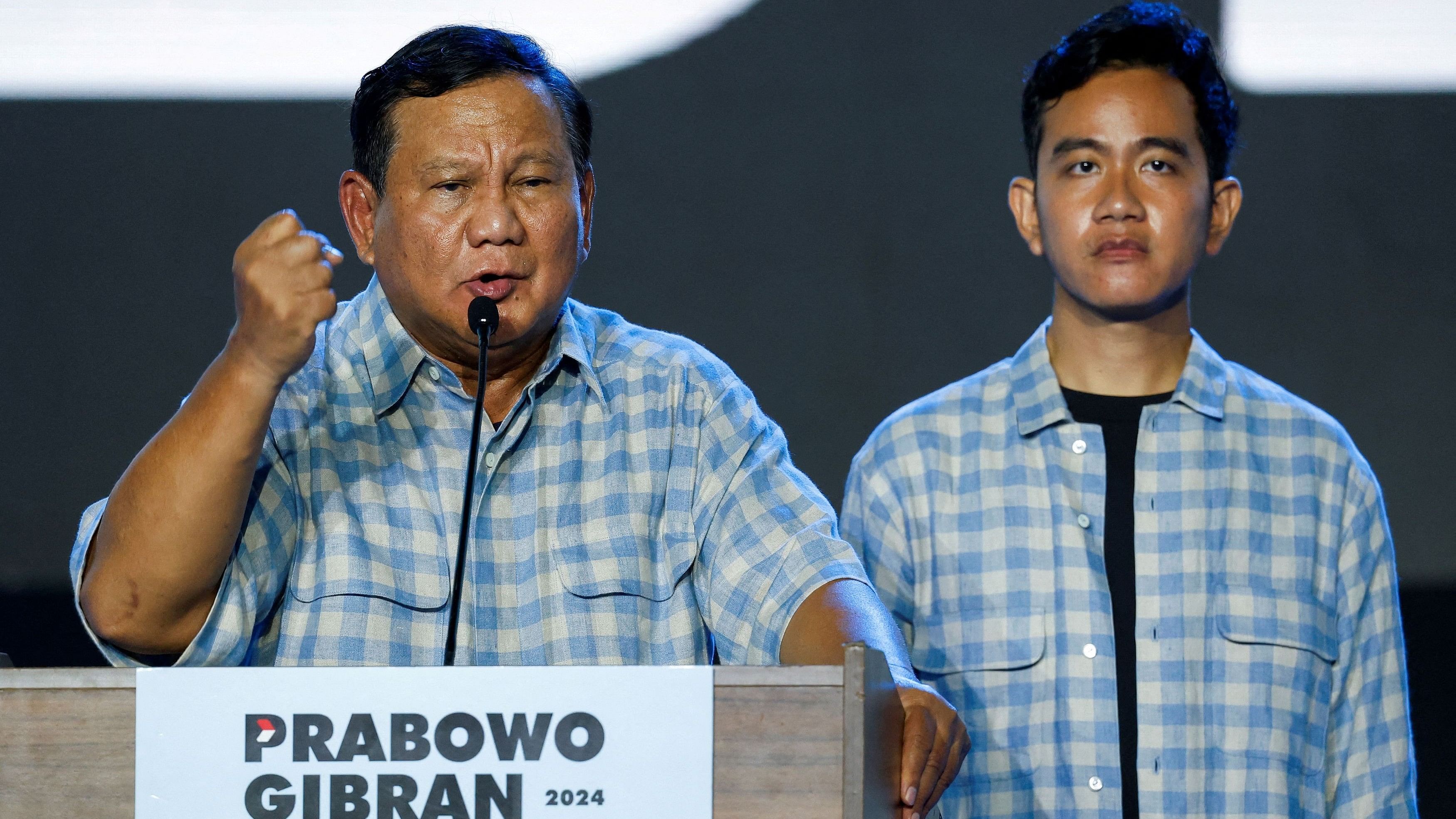 <div class="paragraphs"><p>Indonesia's Defence Minister and leading Presidential candidate Prabowo Subianto delivers his speech as his running mate Gibran Rakabuming Raka, the eldest son of&nbsp;Indonesian President Joko Widodo, stands.</p></div>