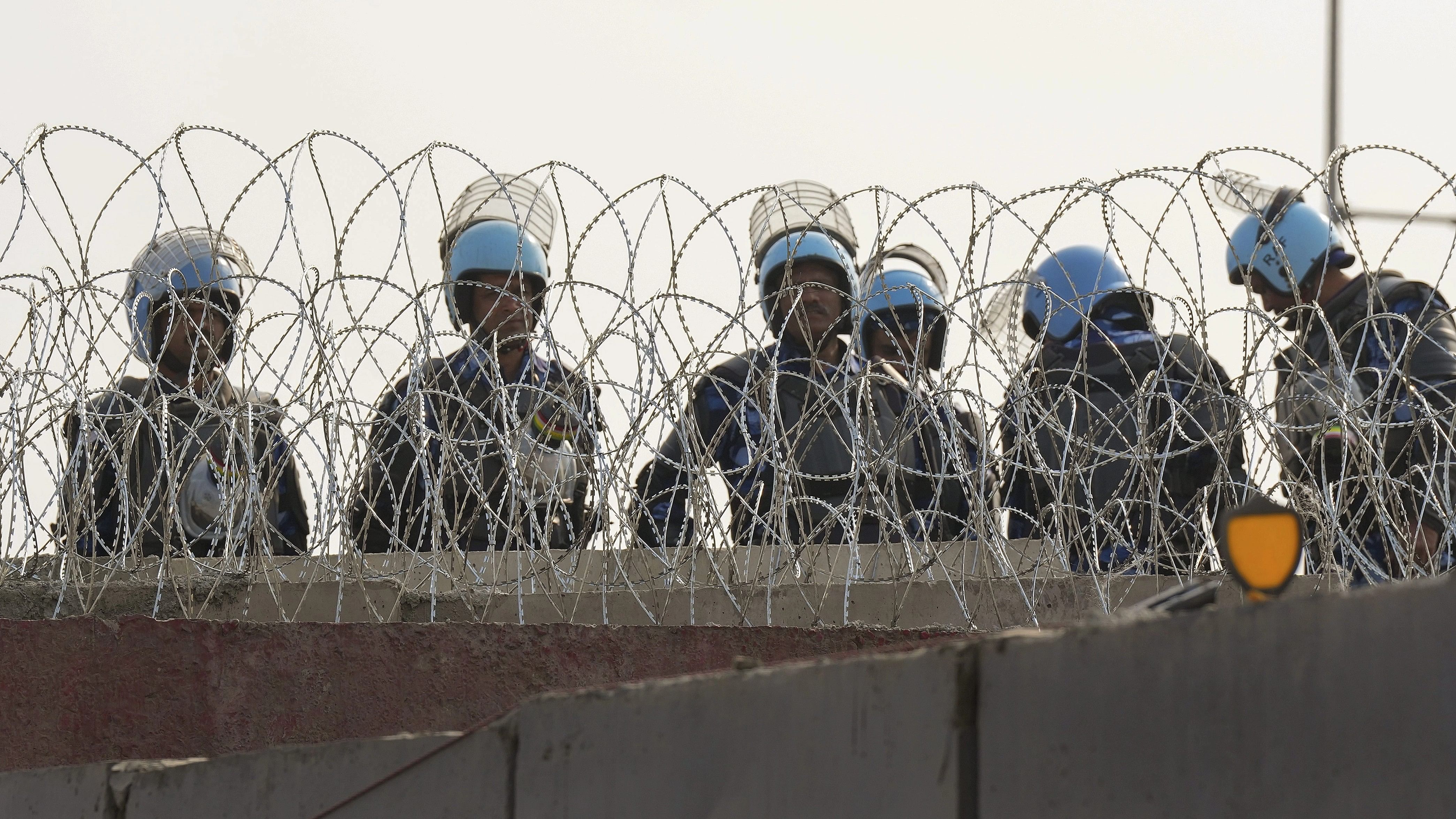 <div class="paragraphs"><p>Security personnel guard near the Singhu border in view of farmers' 'Delhi Chalo' march, in New Delhi, Wednesday, Febraury 14, 2024. </p></div>