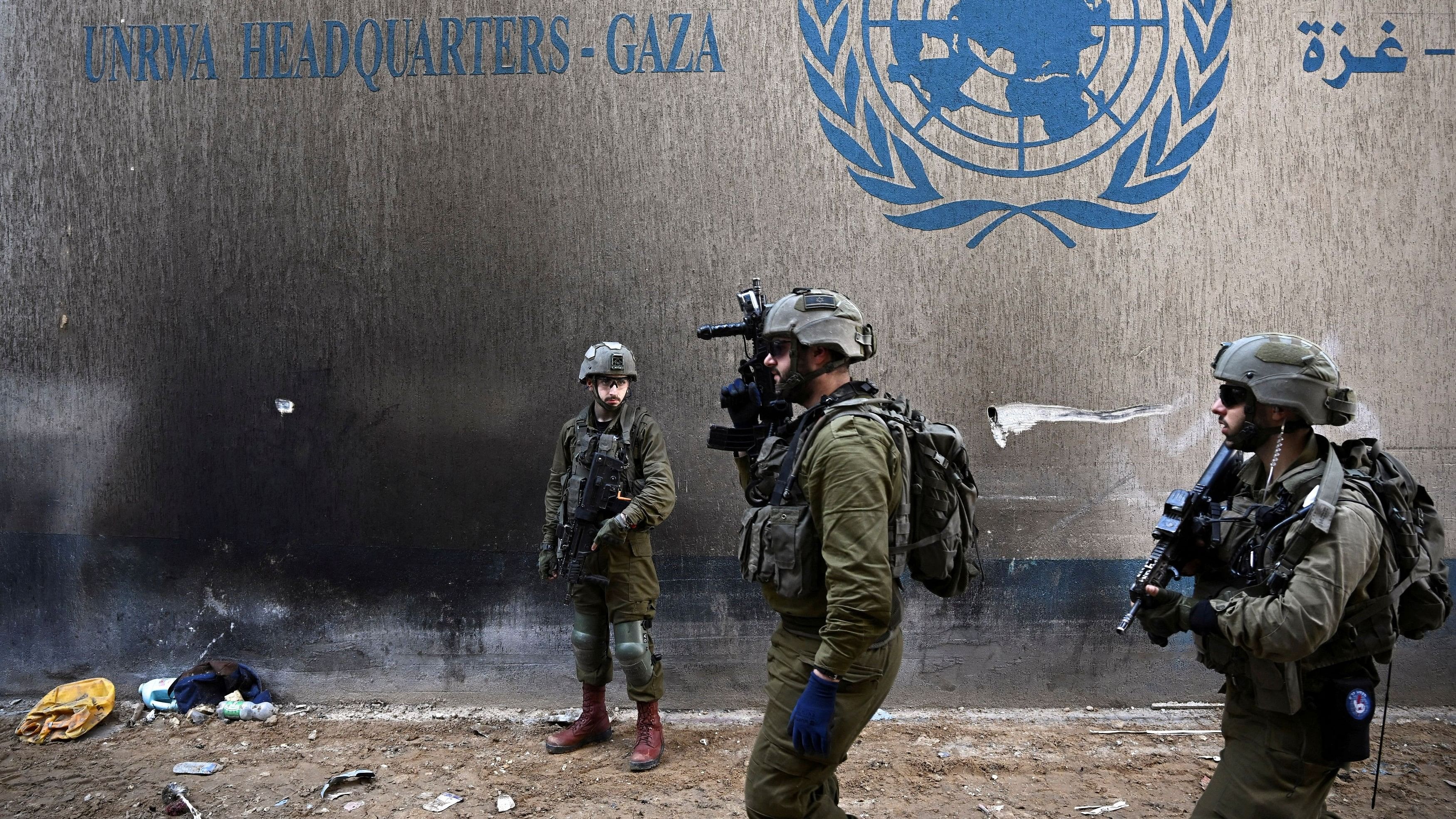 <div class="paragraphs"><p>Israeli soldiers operate next to the UNRWA headquarters, amid the ongoing war between Israel and the Palestinian Islamist group Hamas, in the Gaza Strip, February 8, 2024. </p></div>