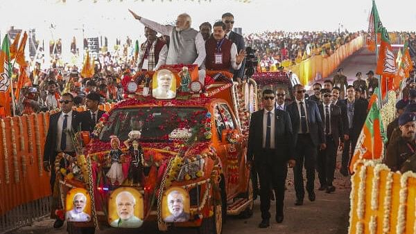 <div class="paragraphs"><p>Prime Minister Narendra Modi with Union Tribal Affairs Minister Arjun Munda and Madhya Pradesh Chief Minister Mohan Yadav at a roadshow during 'Janjatiya Sammelan' in Jhabua, Madhya Pradesh, Sunday, Feb. 11, 2023.</p></div>