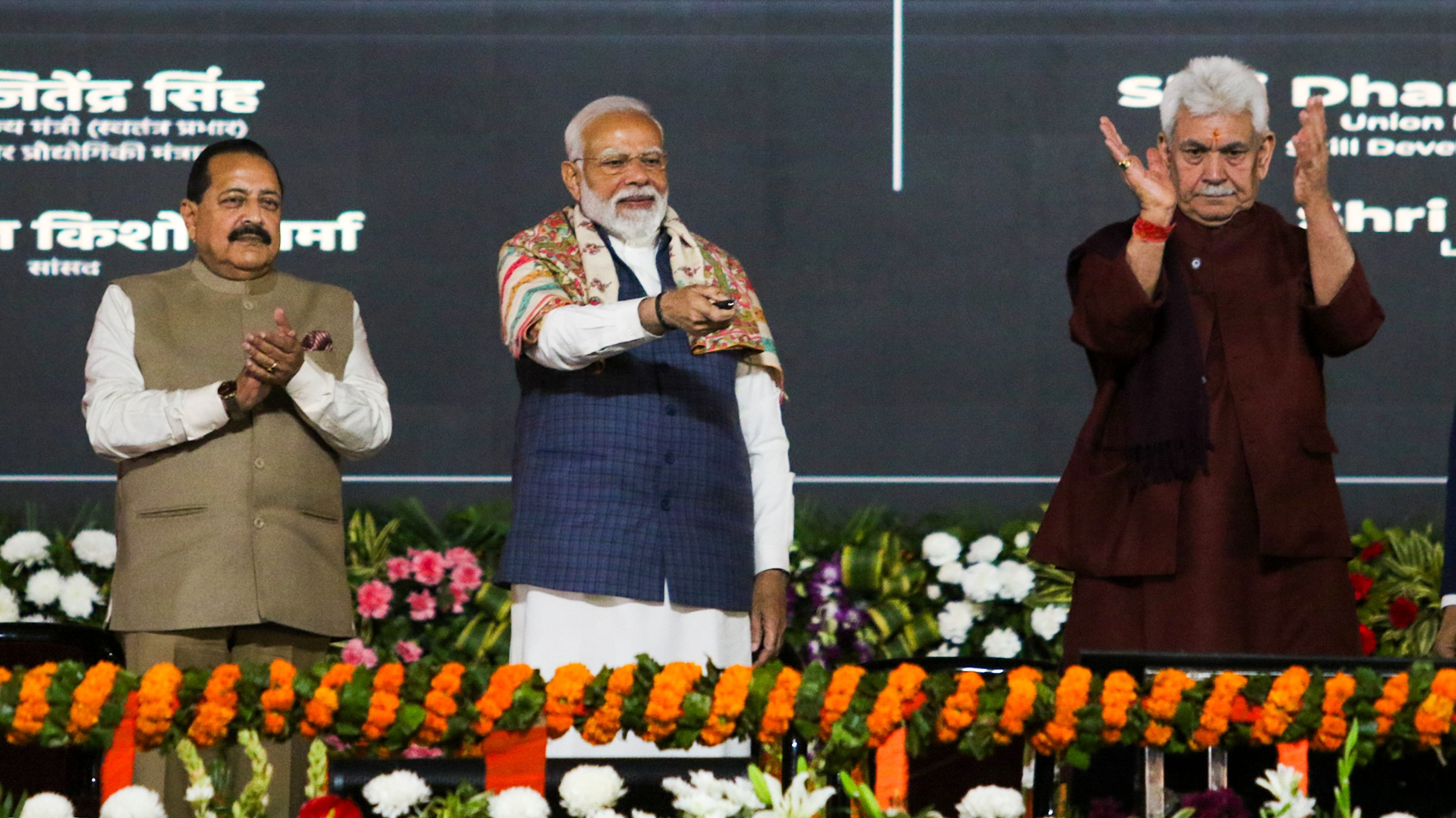 <div class="paragraphs"><p>Prime Minister Narendra Modi with Union Minister Jitendra Singh and J&amp;K Lt Governor Manoj Sinha during the inauguration &amp; foundation stone laying ceremony of multiple developmental projects, in Jammu, on Tuesday</p></div>