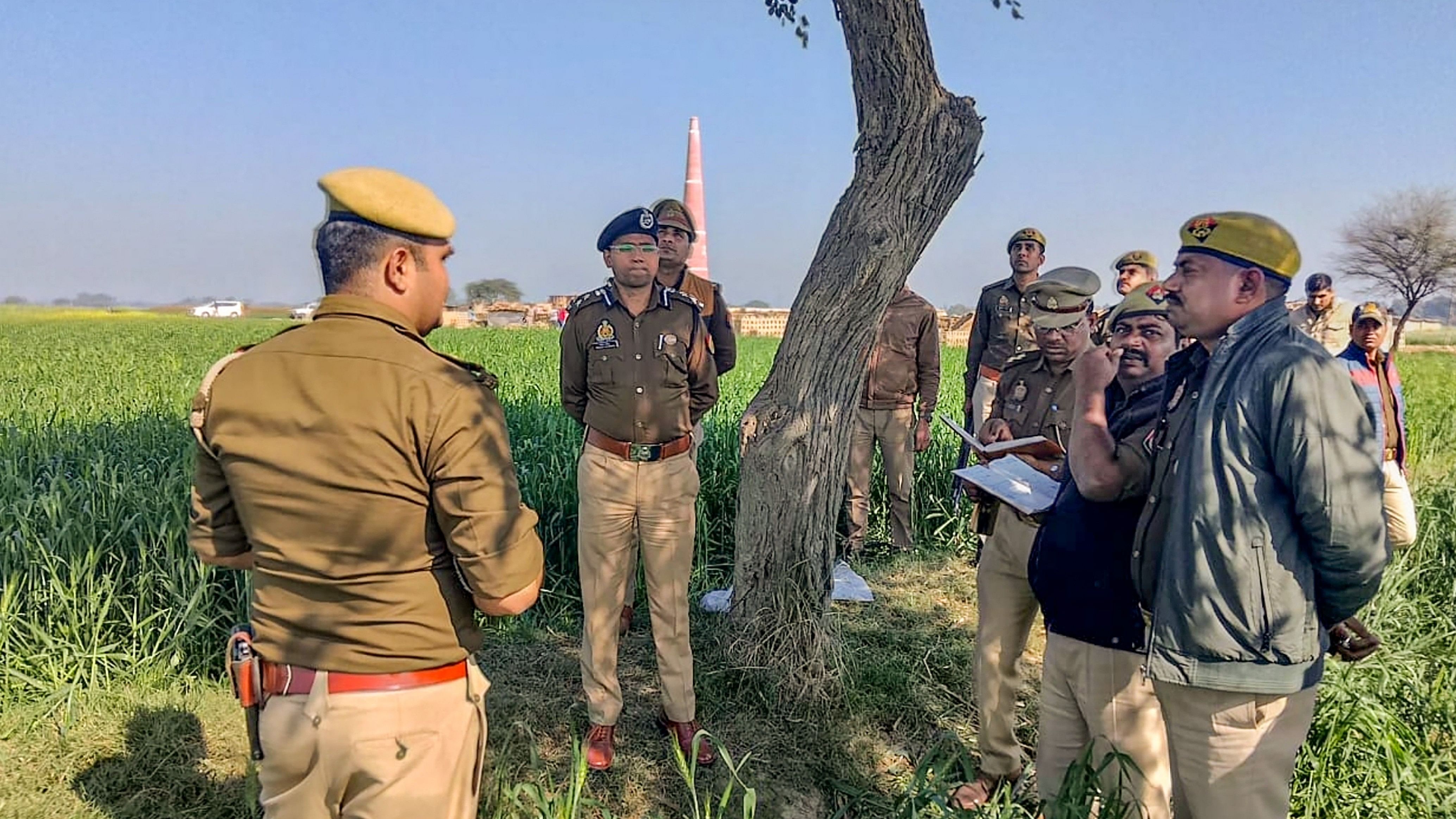 <div class="paragraphs"><p>Kanpur: Police investigate after two minor girls died by suicide by hanging themselves from a tree, allegedly after being sexually assaulted, at a brick Kiln in village Barauli in Ghatampur area of Kanpur district, Thursday, Feb. 29, 2024. </p></div>