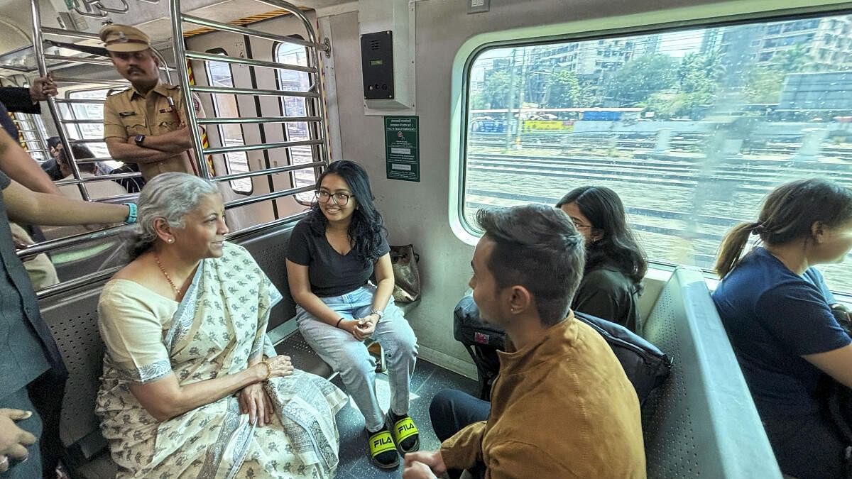 <div class="paragraphs"><p>Union Finance Minister Nirmala Sitharaman interacts with commuters while travelling from Ghatkopar to Kalyan in a local train, in Mumbai, Saturday, Feb. 24, 2024.</p></div>