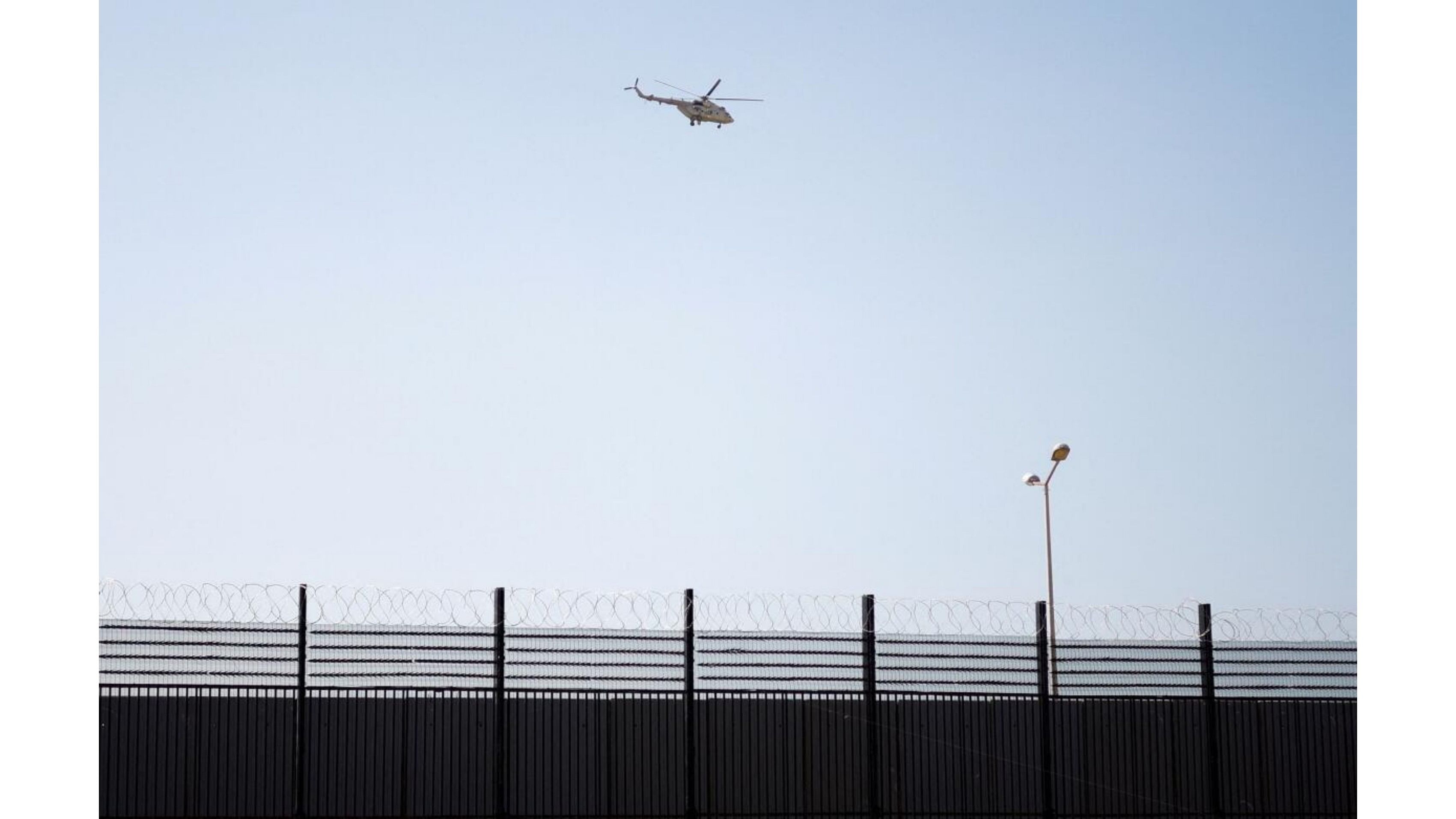 <div class="paragraphs"><p>An Egyptian helicopter patrols the border area between Egypt and Gaza.</p></div>