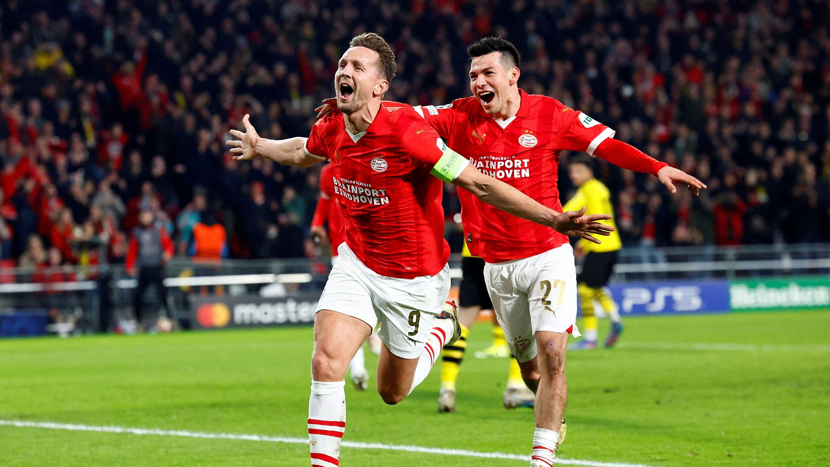 <div class="paragraphs"><p>PSV's Luuk de Jong (left) after scoring their first goal with teammate Hirving Lozano (right).</p></div>