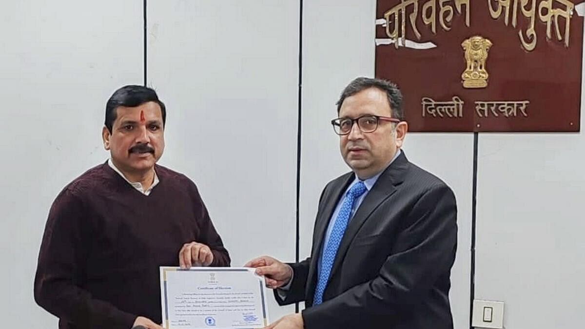 <div class="paragraphs"><p>Sanjay Singh receives his certificate from Returning Officer Ashish Kundra after he was elected unopposed to the Rajya Sabha.</p></div>