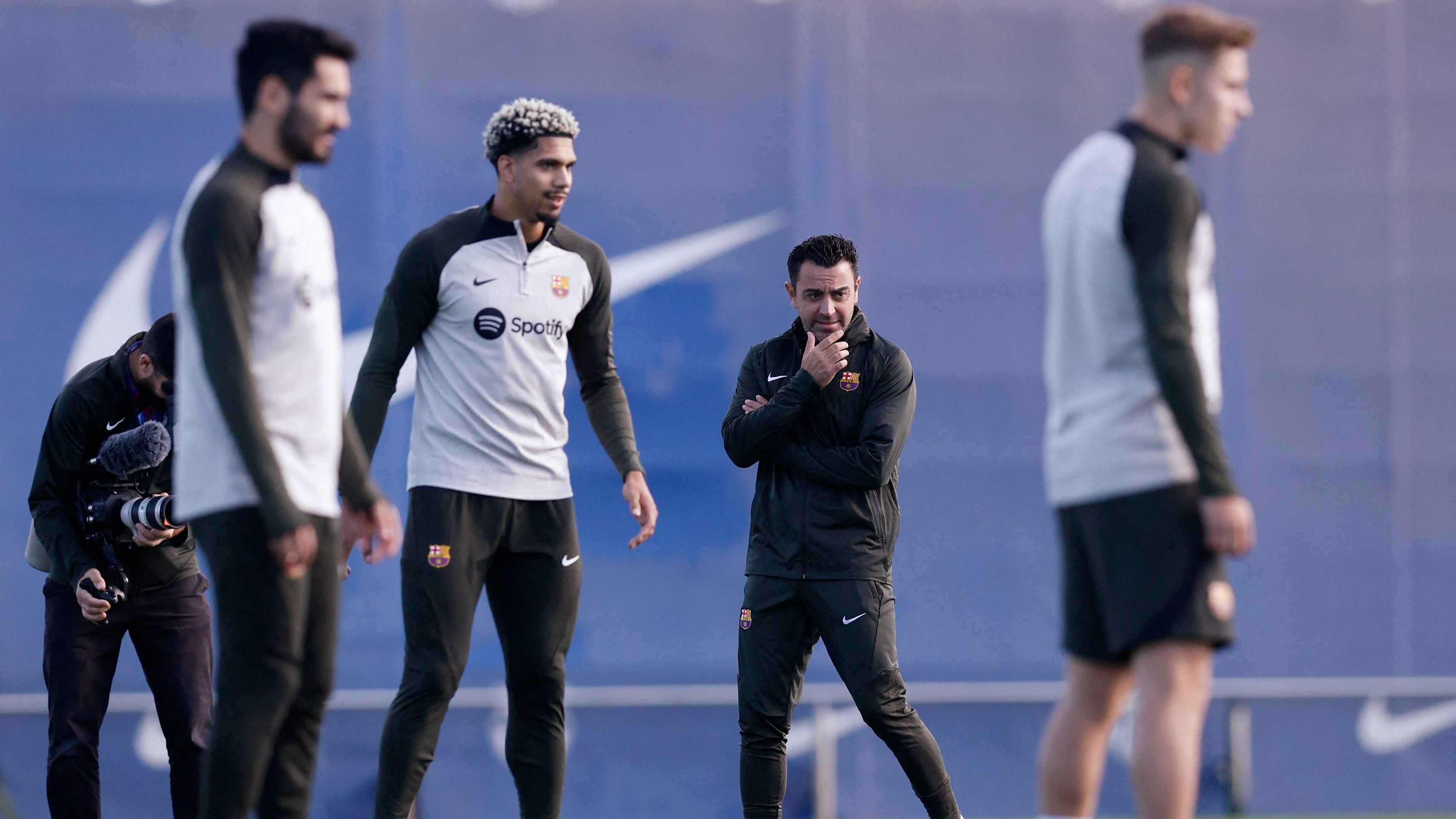 <div class="paragraphs"><p>A file photo of&nbsp;Barcelona coach Xavi Hernandez with players during training.&nbsp;</p></div>
