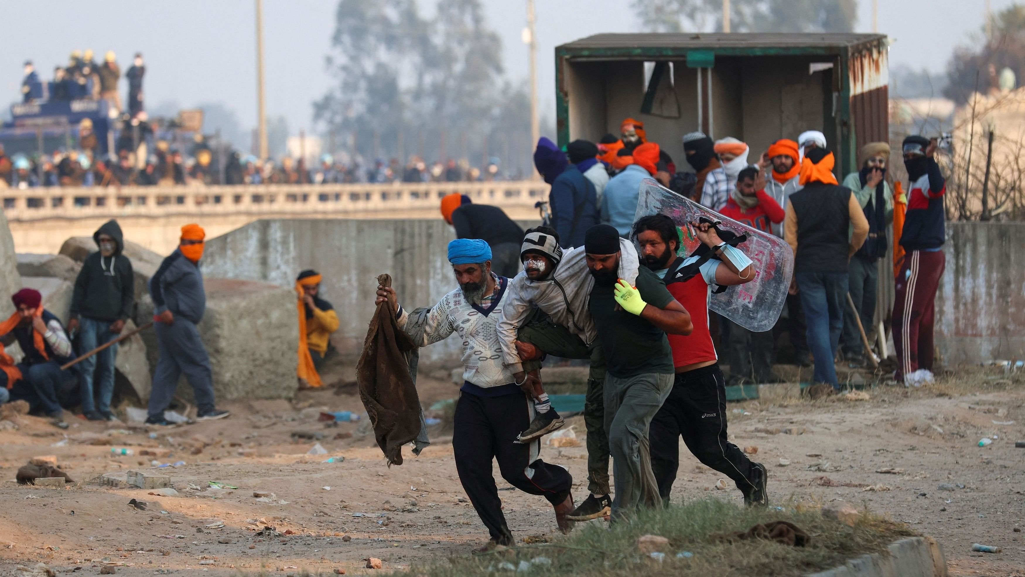 <div class="paragraphs"><p>Farmers, marching towards New Delhi to press for better crop prices promised to them in 2021, carry an injured protester at Shambhu, a border crossing between Punjab and Haryana, February 14, 2024. </p></div>