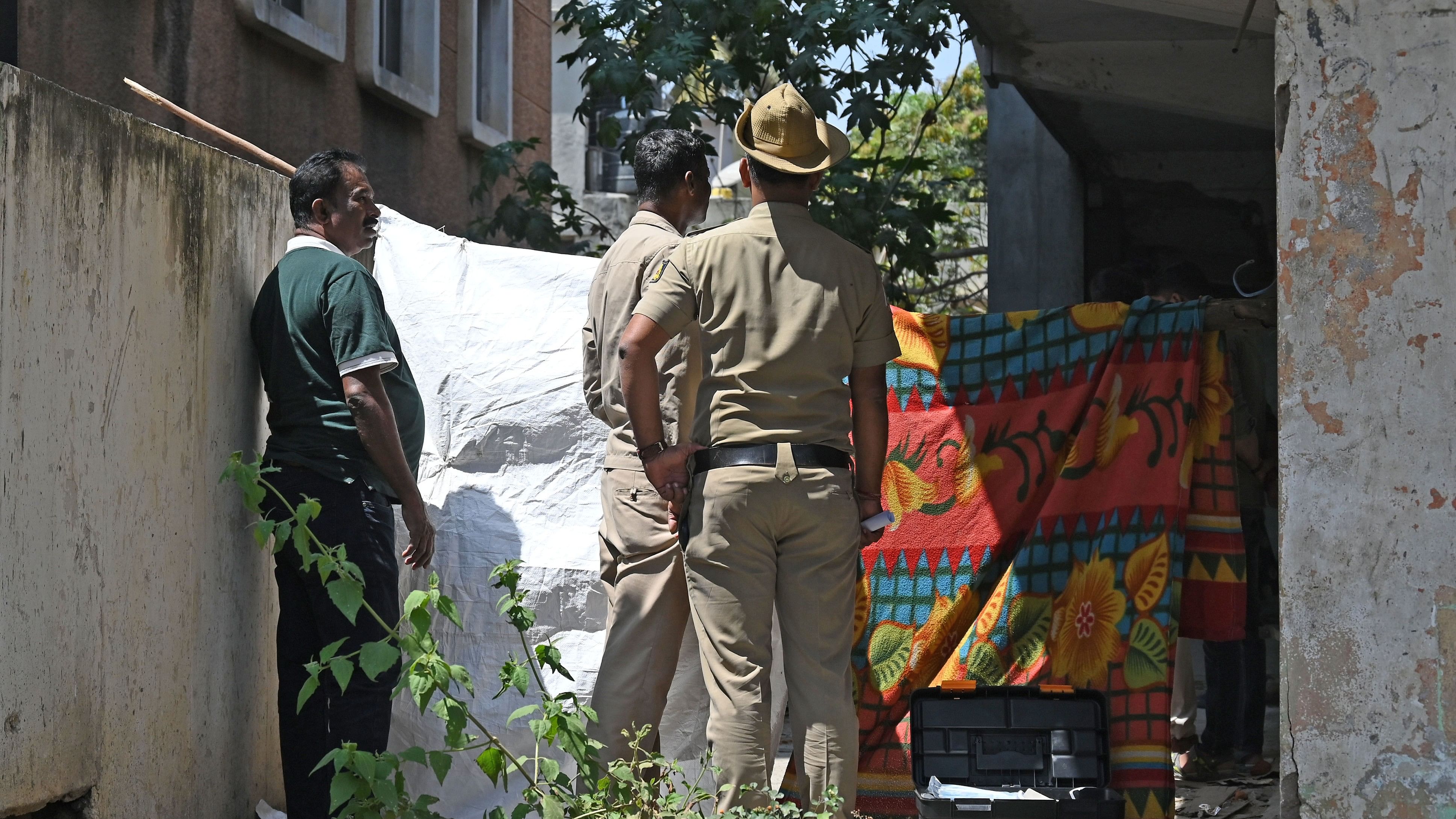 <div class="paragraphs"><p>Police cordon off the area where the woman’s body was found near Double Road on Tuesday. </p></div>