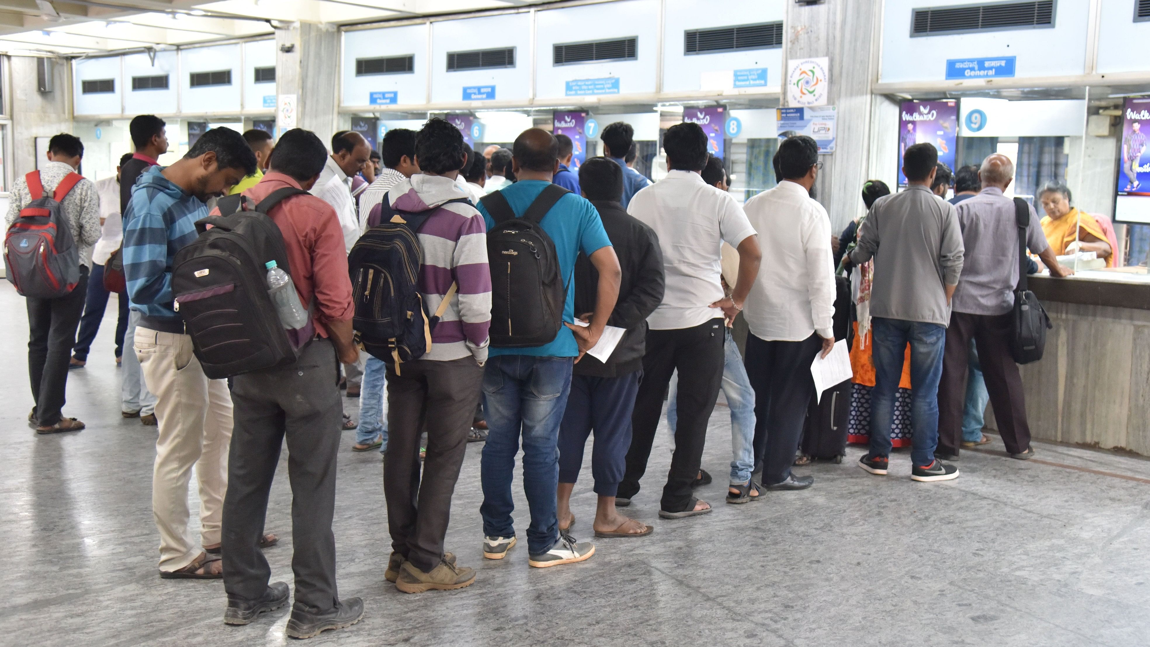 <div class="paragraphs"><p>People lined up in front of Railway reservation counter in Bengaluru.</p></div>