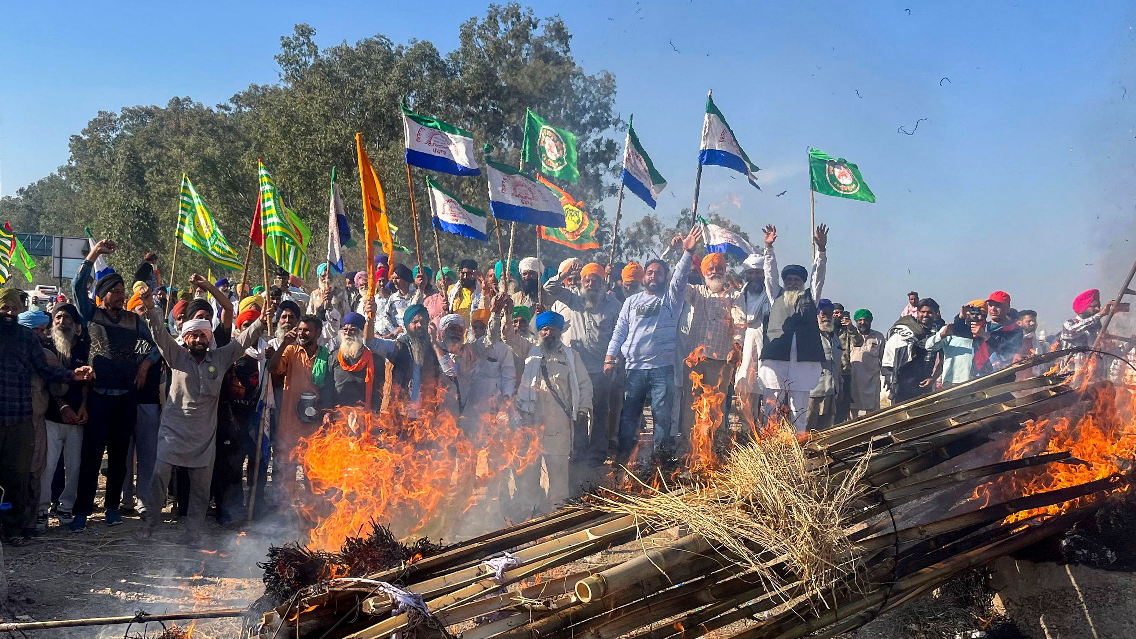 <div class="paragraphs"><p> Farmers holding flags shout slogans against corporate houses during a protest as part of their 'Delhi Chalo' march, near the Punjab-Haryana Shambhu border, in Patiala.</p></div>
