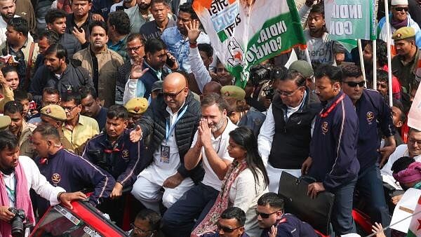 <div class="paragraphs"><p>Congress party leader Rahul Gandhi (C) gestures to the public from atop a vehicle during the 'Bharat Jodo Yatra' roadshow in Varanasi on February 17, 2024.</p></div>