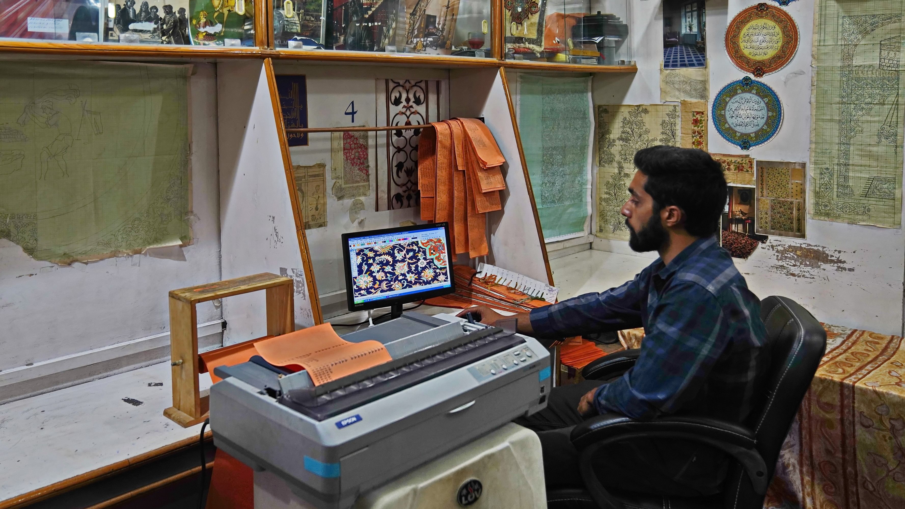 <div class="paragraphs"><p>A naqash working on a computer to design, colour, code and print the taleem set. </p></div>