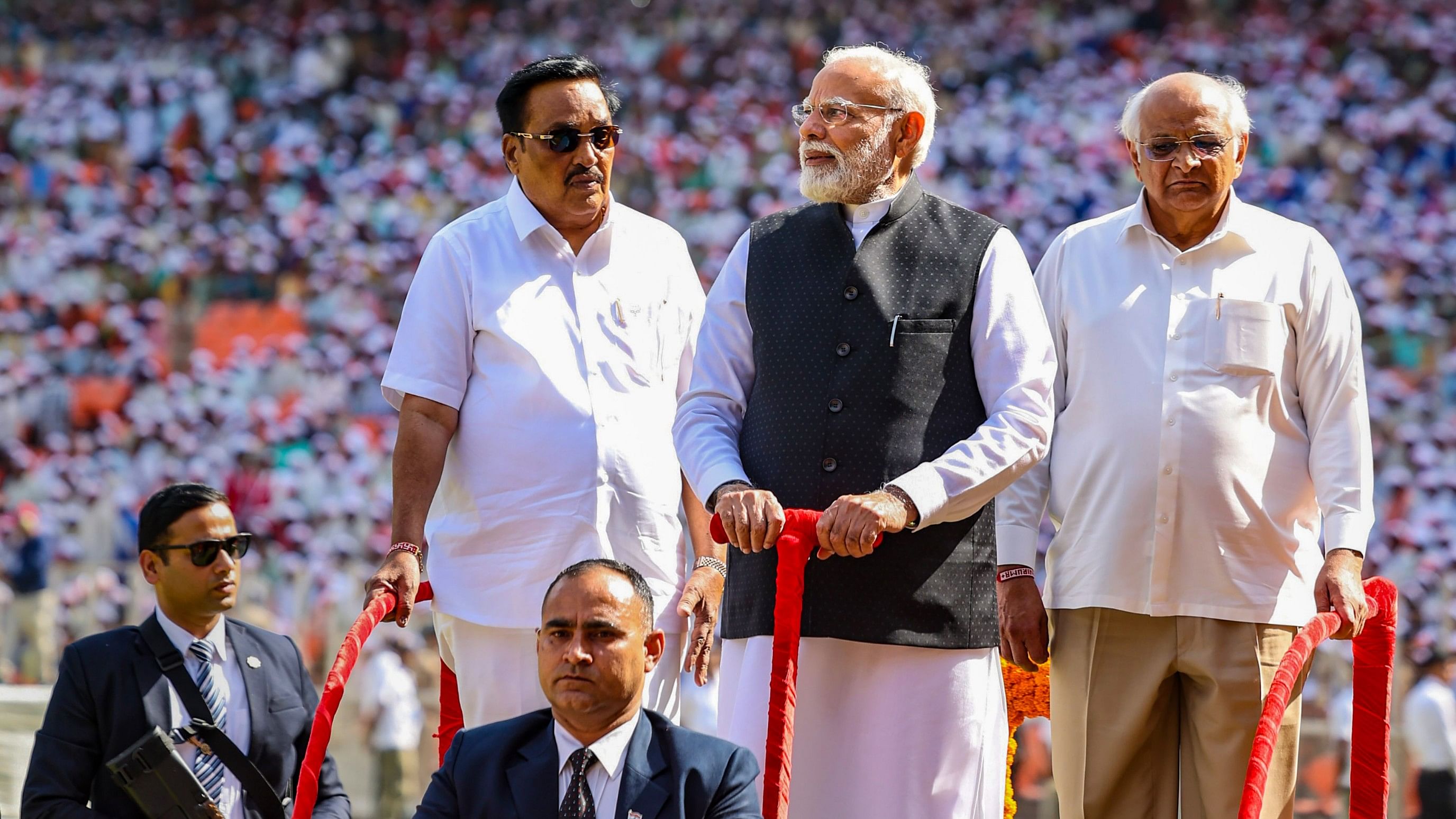 <div class="paragraphs"><p>Prime Minister Narendra Modi with Gujarat CM  Bhupendra Patel and the state BJP chief CR Paatil greets the gathering during the golden jubilee celebration of Gujarat Cooperative Milk Marketing Federation in Ahmedabad.</p></div>