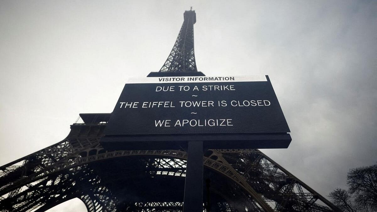 <div class="paragraphs"><p>File photo of a sign reading 'Due to a strike, the Eiffel Tower is closed. We apoligize' hangs in front of the Eiffel Tower in Paris.</p></div>