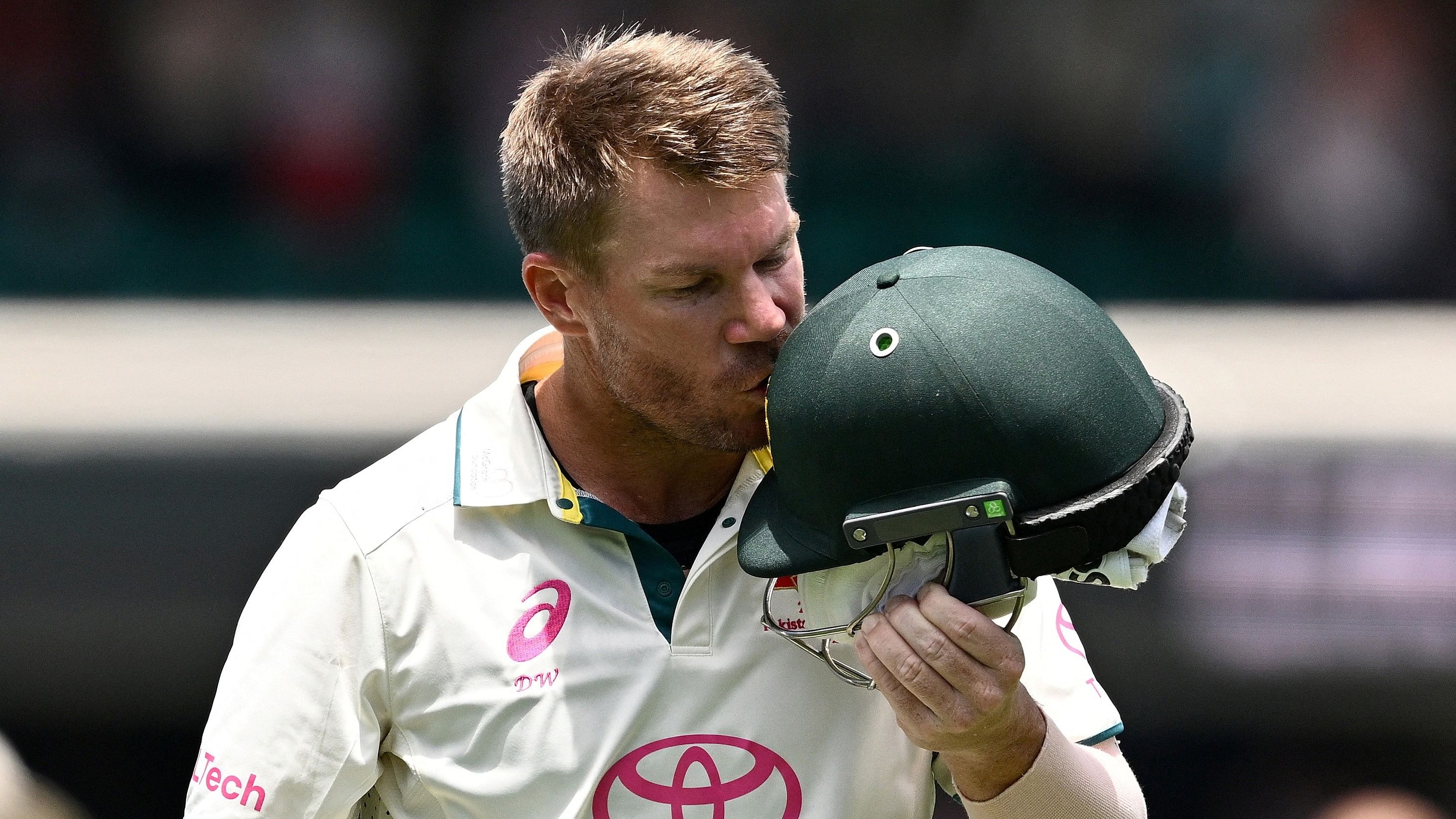 <div class="paragraphs"><p>David Warner kisses the coat of arms on his helmet as he leaves the field in his last test match after being dismissed off the bowling of Pakistan's Sajid Khan Dan.</p></div>