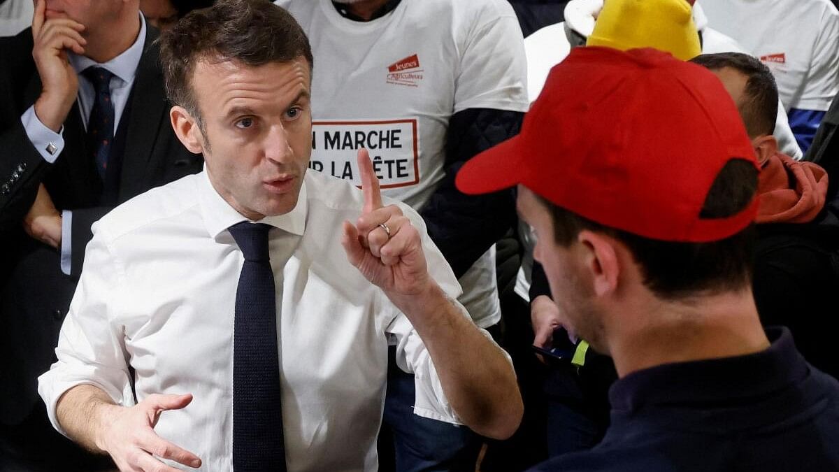 <div class="paragraphs"><p>French President Emmanuel Macron gestures during in a discussion with French farmers at the Porte de Versailles exhibition centre, on the day of the opening of the 60th International Agriculture Fair (Salon de l'Agriculture), in Paris, France.</p></div>