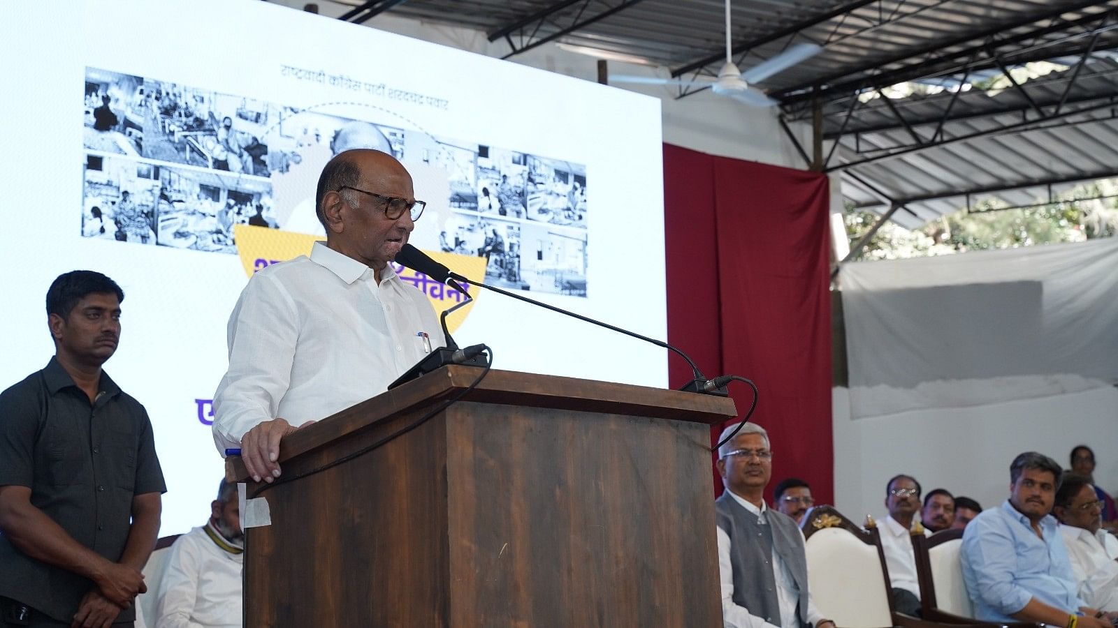 <div class="paragraphs"><p>A photo of Sharad Pawar addressing a gathering.</p></div>