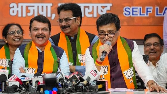 <div class="paragraphs"><p>Former Maharashtra CM and Congress leader Ashok Chavan with Maharashtra Deputy Chief Minister Devendra Fadnavis addresses media after joining BJP, in Mumbai, Tuesday, Feb. 13, 2024.</p></div>