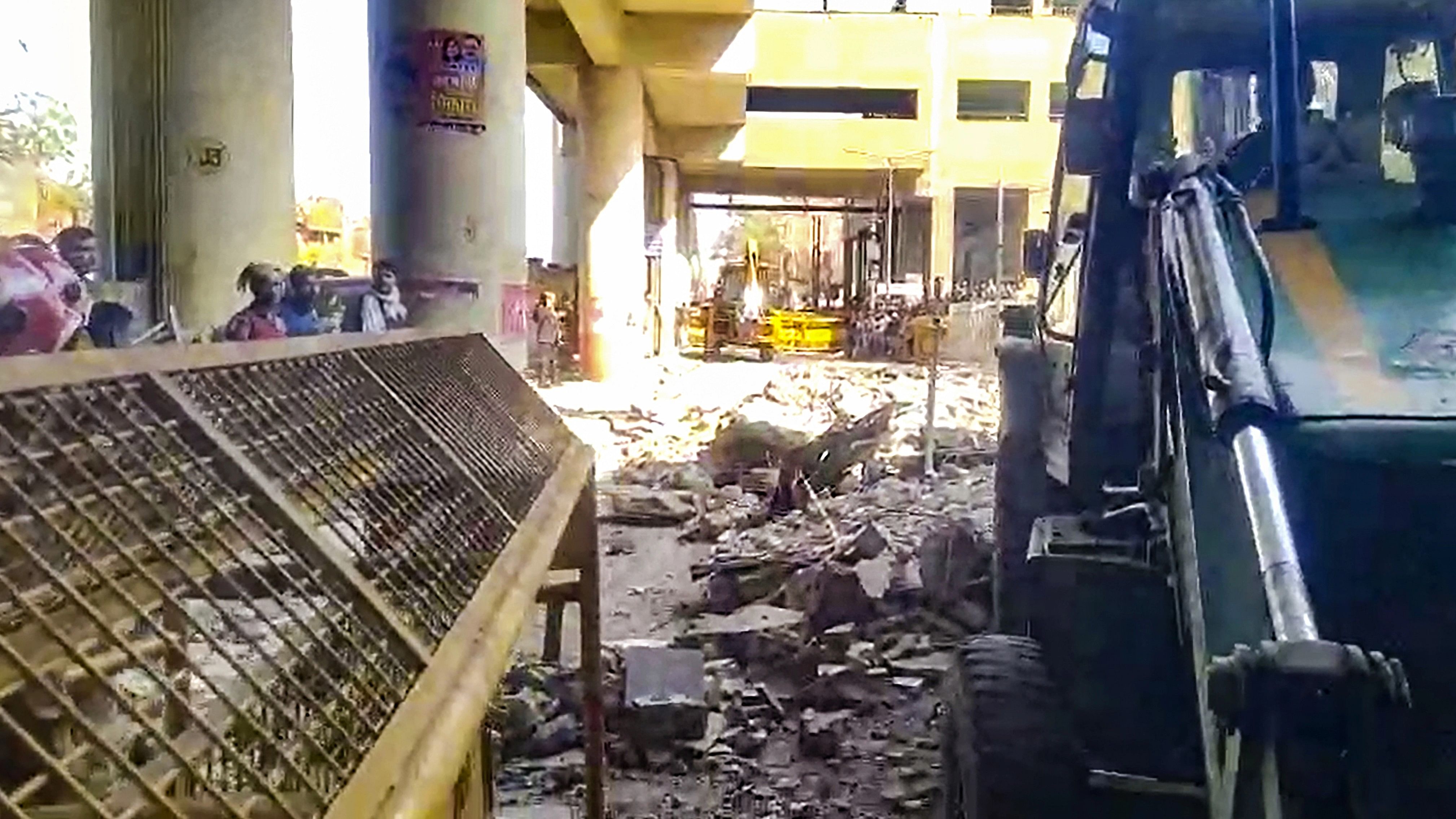 <div class="paragraphs"><p> An earthmover removes debris after the collapse of a portion of Gokalpuri Metro Station, in New Delhi, Thursday, February 8, 2024.</p></div>