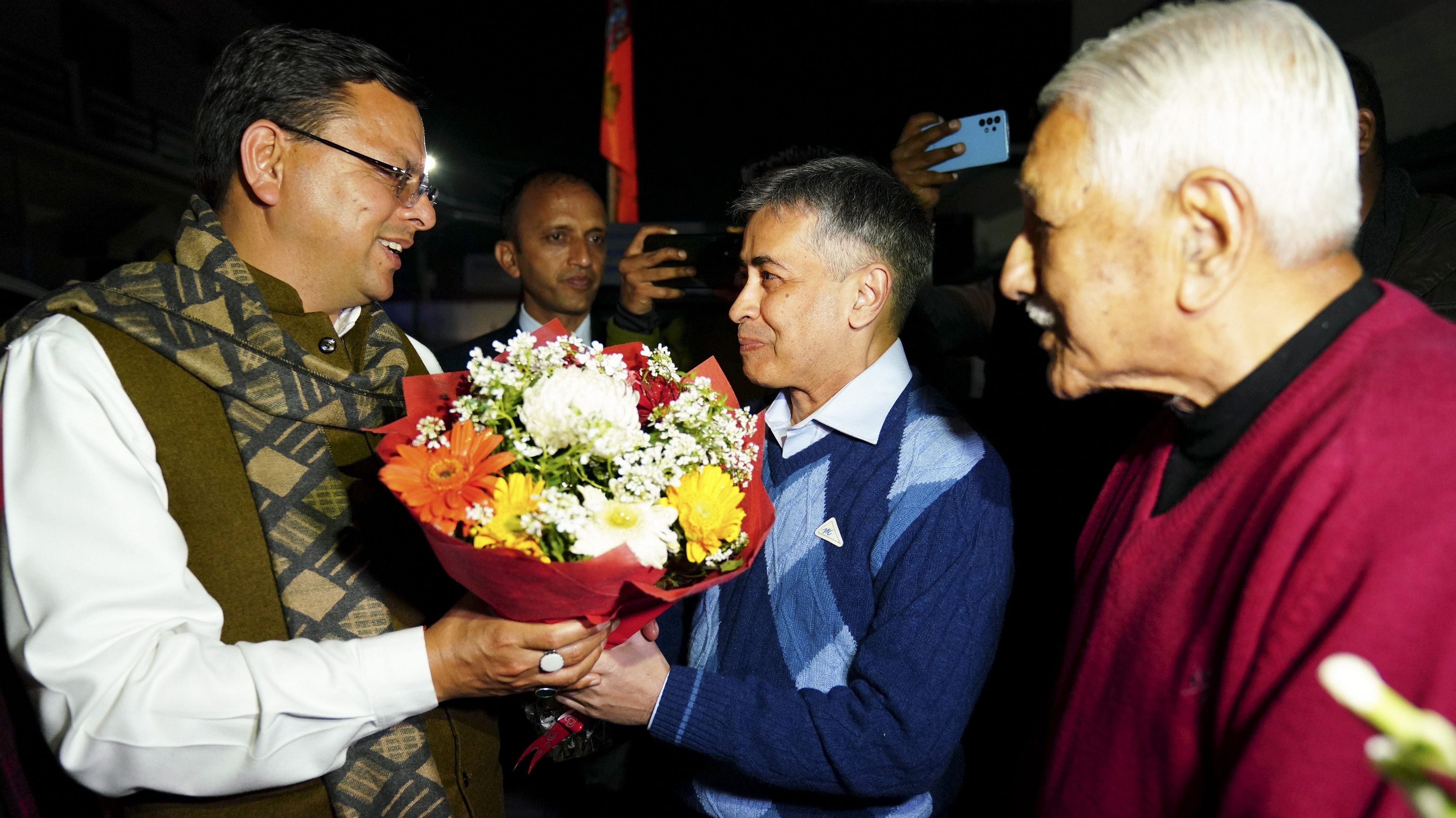<div class="paragraphs"><p>A file photo of Uttarakhand Chief Minister Pushkar Singh Dhami meeting retired Indian Navy captain Saurabh Vashishtha, who returned to India  after being released from a Qatar jail.</p></div>