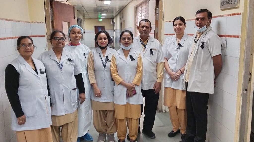<div class="paragraphs"><p>Doctors and nurses protest&nbsp;Delhi government-run hospitals by wearing&nbsp;black ribbons to put forth their demands for regularisation on Friday&nbsp;</p></div>