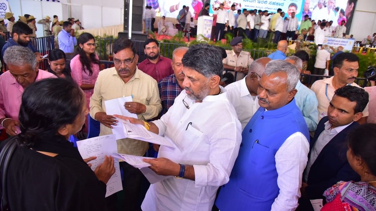 <div class="paragraphs"><p>Deputy Chief Minister DK Shivakumar interacts with citizens at the grievance redressal programme in RR Nagar on Sunday.  </p></div>