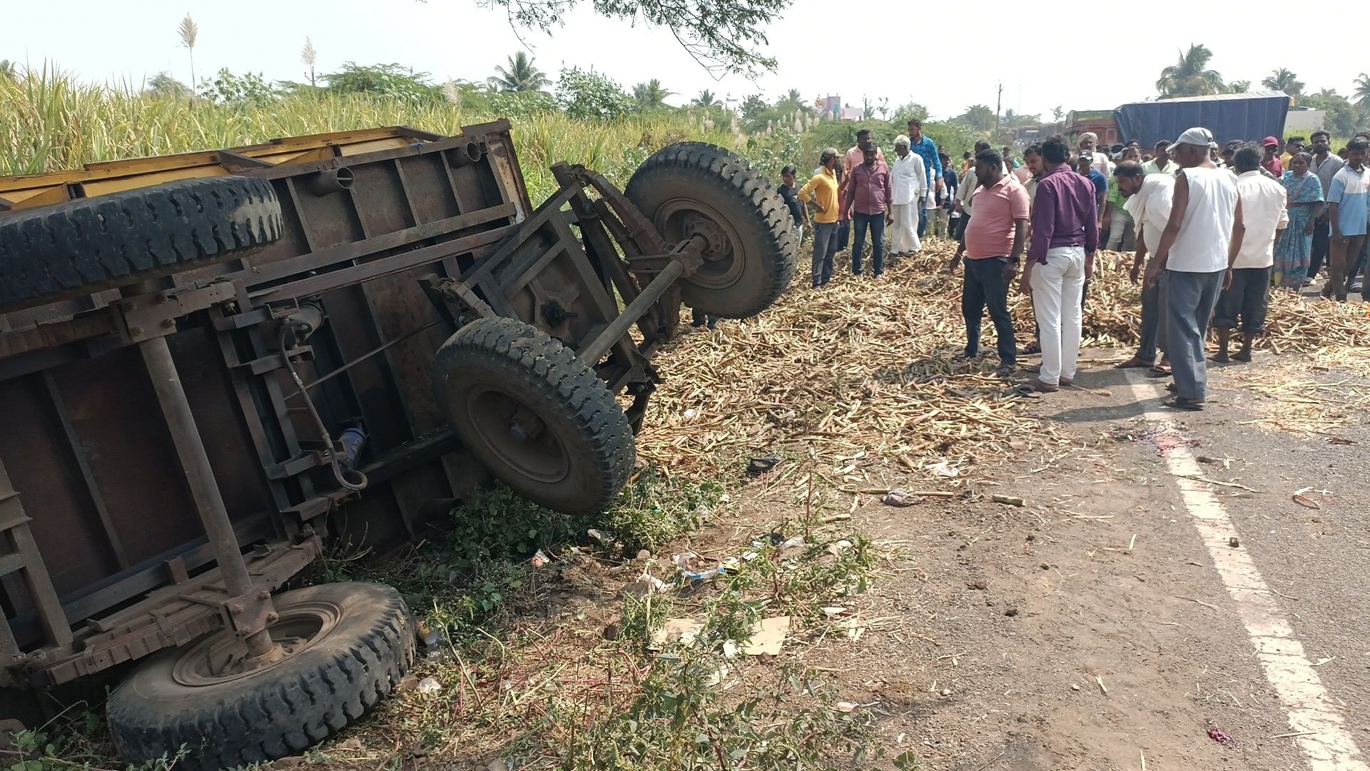 A sugarcane-laden tractor trolley toppled near Shedbal in Belagavi district, killing three women on the spot, on Sunday.