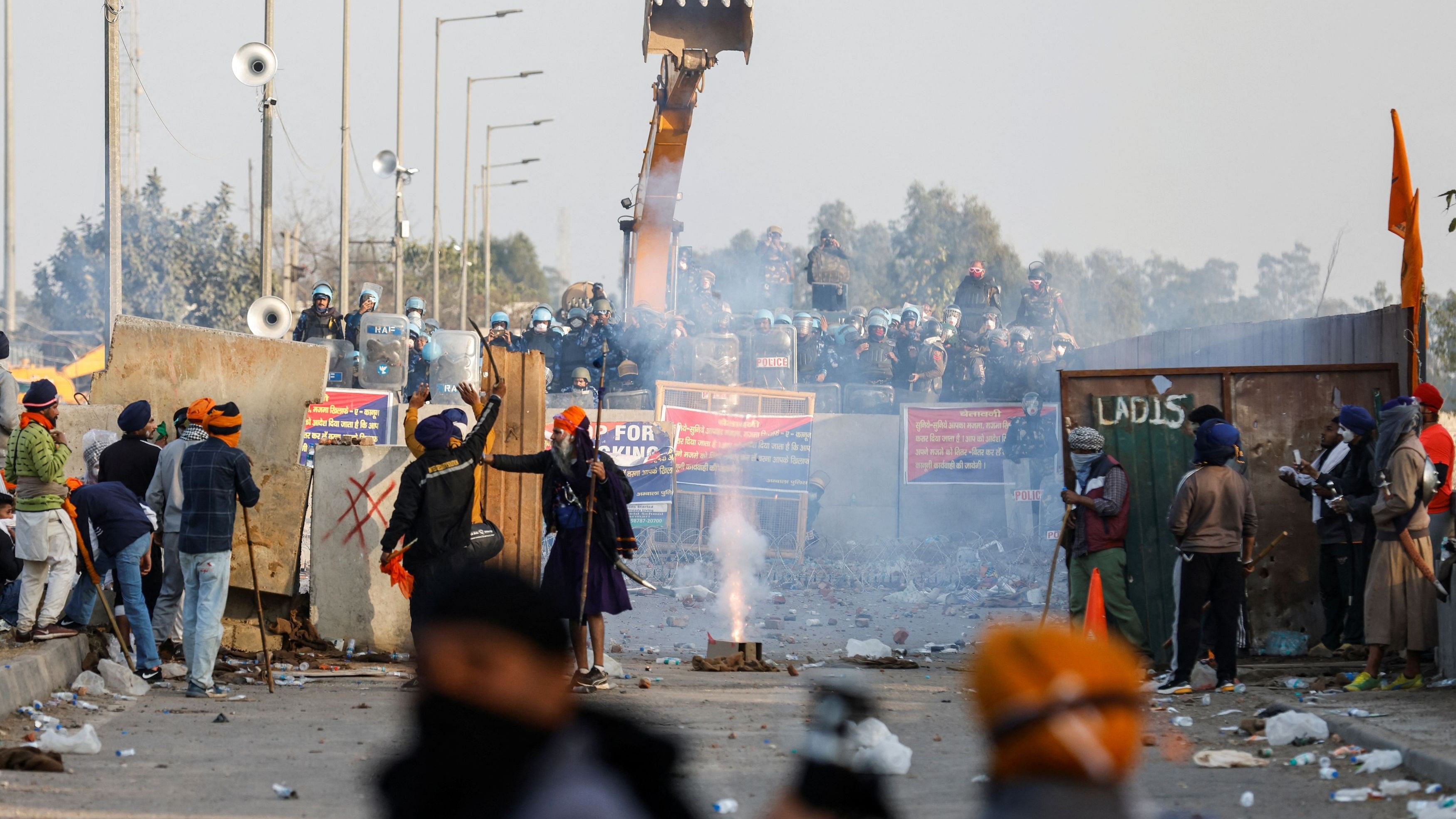 <div class="paragraphs"><p>Farmers launch firecrackers towards police as farmers march towards New Delhi to press for better crop prices promised to them in 2021, next to Shambhu barrier, a border crossing between Punjab and Haryana, February 21, 2024.  </p></div>