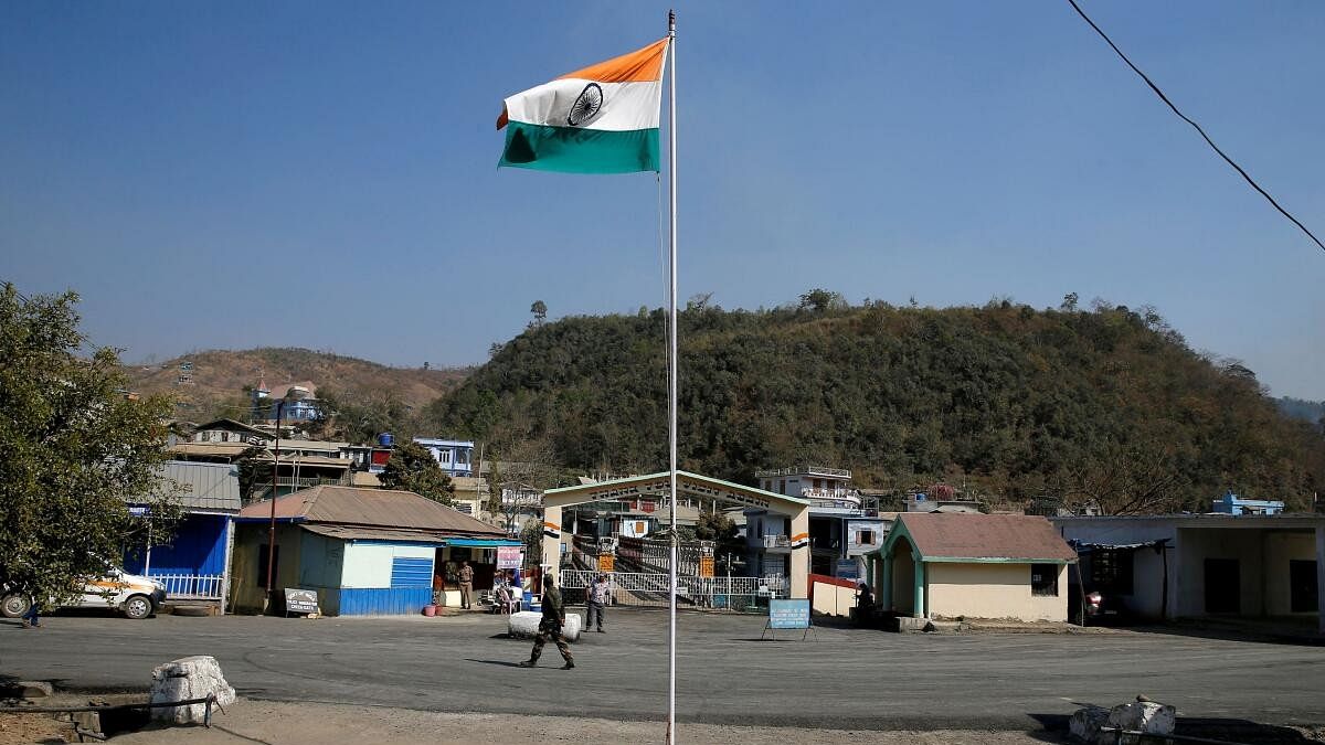 <div class="paragraphs"><p>An Indian national flag flies next to an immigration check post on the India-Myanmar border in Zokhawthar village.</p></div>