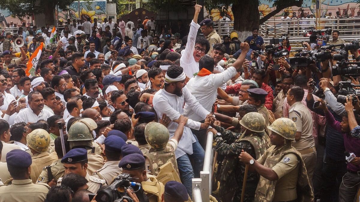 <div class="paragraphs"><p>Police personnel try to stop Congress workers during a protest march against the Odisha government over alleged corruption in the government, in Bhubaneswar.&nbsp;</p></div>