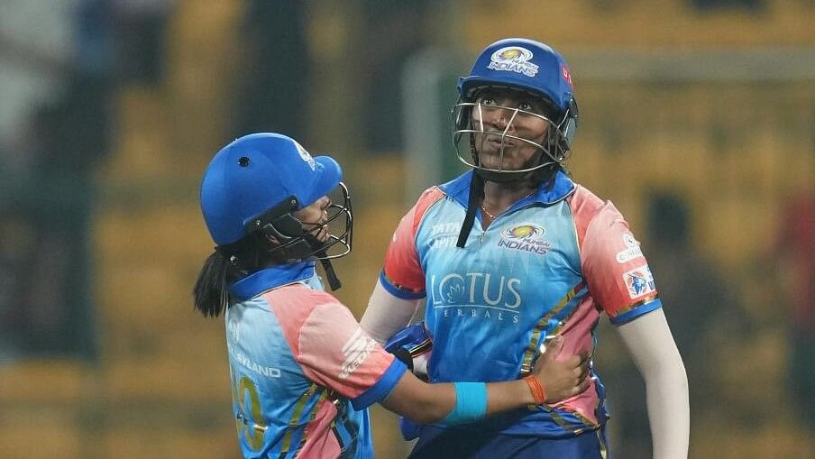 <div class="paragraphs"><p>Mumbai Indians batters Sajeevan Sajana(R) and Amanjot Kaur celebrate the WPL 2024 match over Delhi Capitals, at the M Chinnaswamy Stadium in Bengaluru.&nbsp;</p></div>