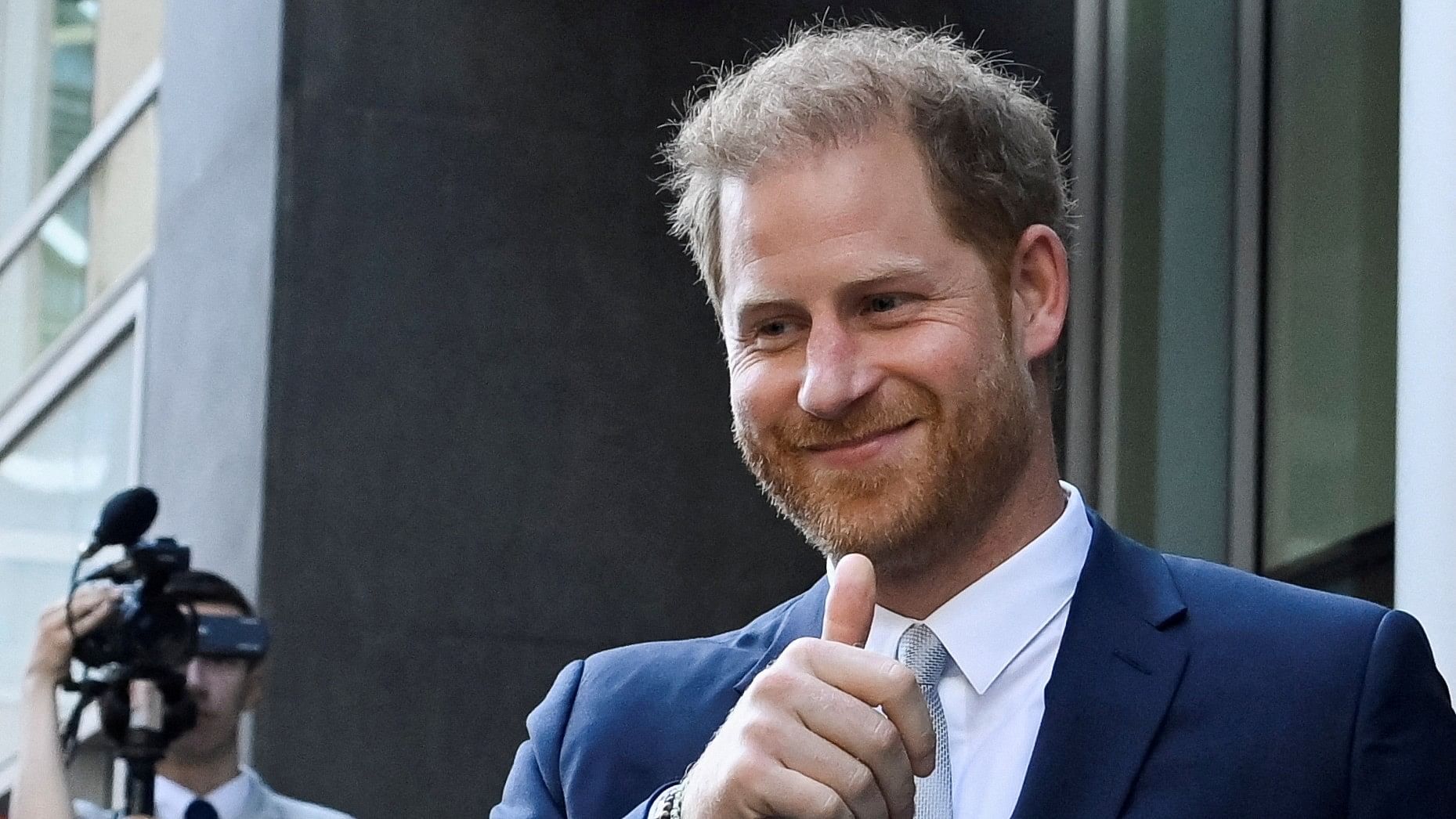<div class="paragraphs"><p>Prince Harry gestures as he departs the Rolls Building of the High Court in London, Britain.</p></div>
