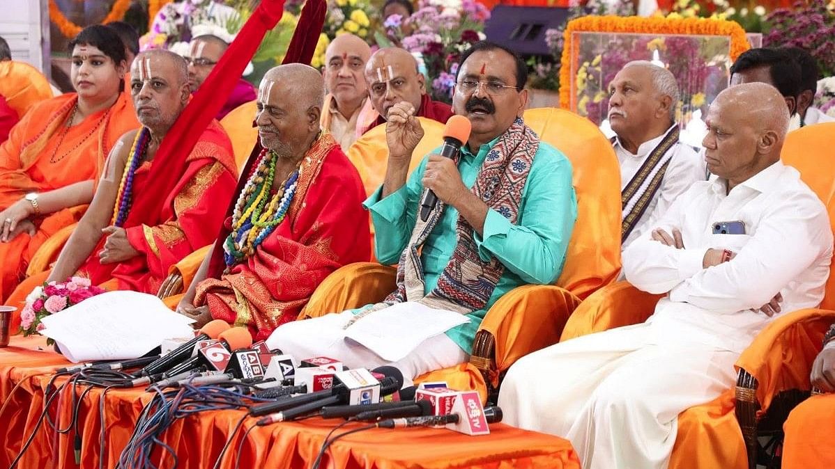 <div class="paragraphs"><p>TTD Chairman Bhumana Karunakar Reddy speaks as Hindu pontiffs look on at the 3-day religious enclave.</p></div>