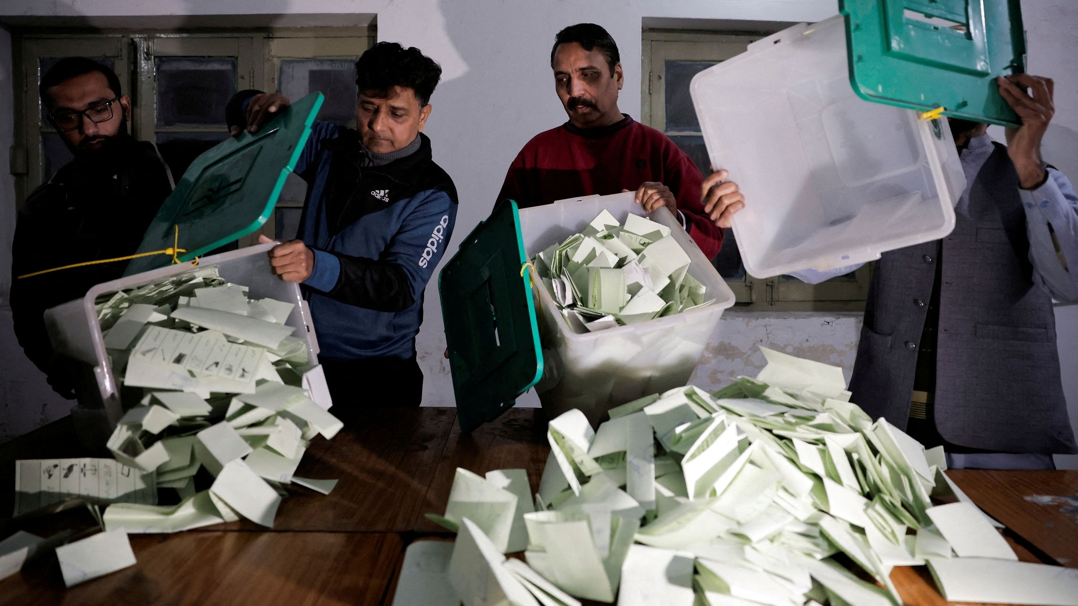 <div class="paragraphs"><p>Polling staff empty a ballot box after polls closed at a polling station during the general election, in Lahore, Pakistan.</p></div>