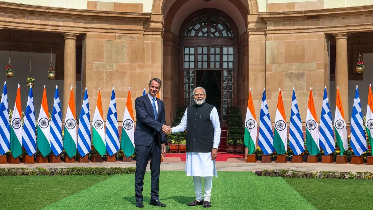 <div class="paragraphs"><p>Prime Minister Narendra Modi shakes hands with the Prime Minister of Greece Kyriakos Mitsotakis at the Hyderabad House, in New Delhi, Wednesday, February 21, 2024.</p></div>