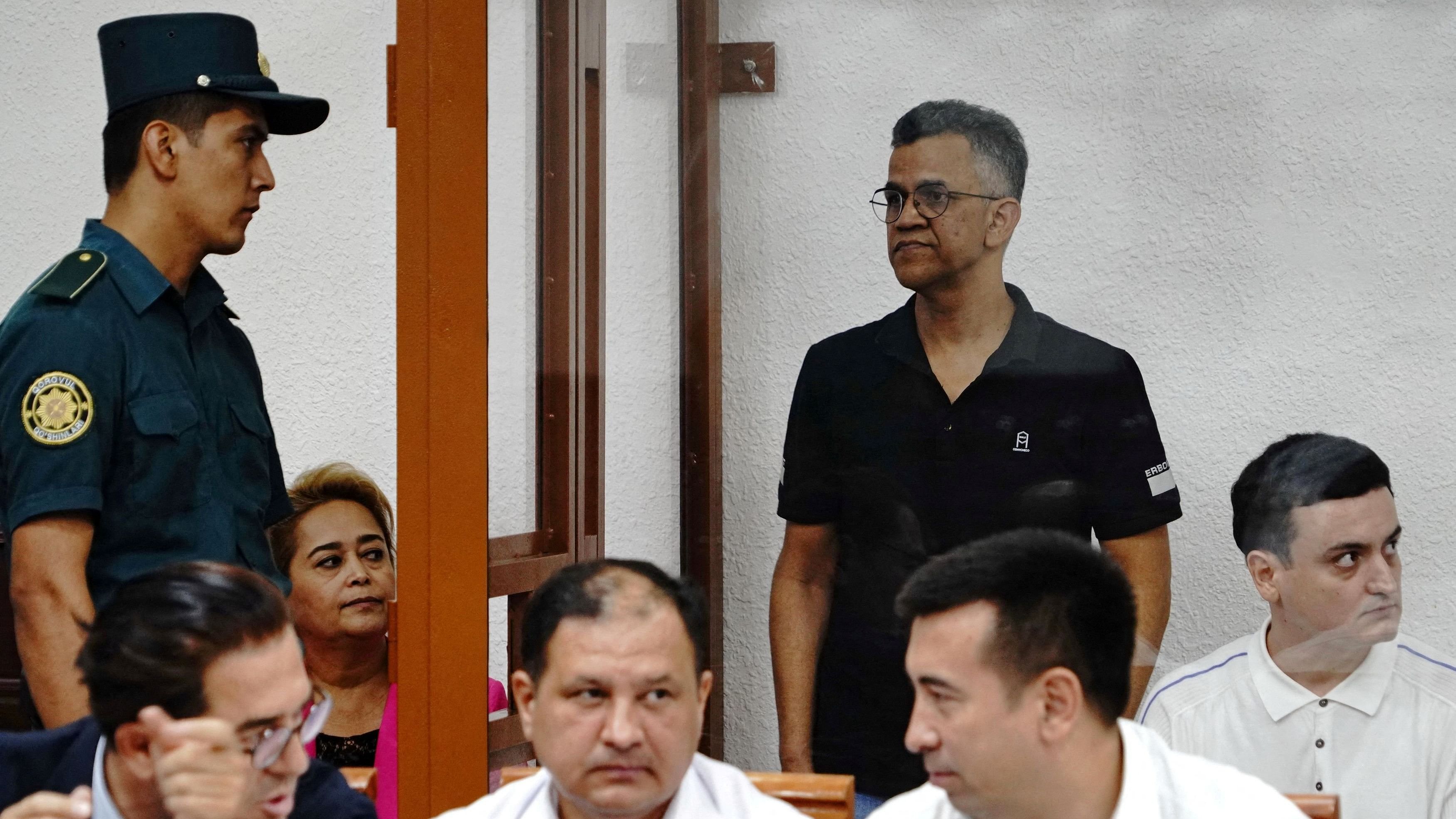 <div class="paragraphs"><p>File Photo: Defendant Singh Raghvendra Pratar, an executive of Quramax Medical, a company that sold medicines produced by India's Marion Biotech in Uzbekistan, stands inside an enclosure for defendants during a court hearing in the case of child deaths linked to contaminated cough syrups, in Tashkent, Uzbekistan, August 16, 2023. </p></div>