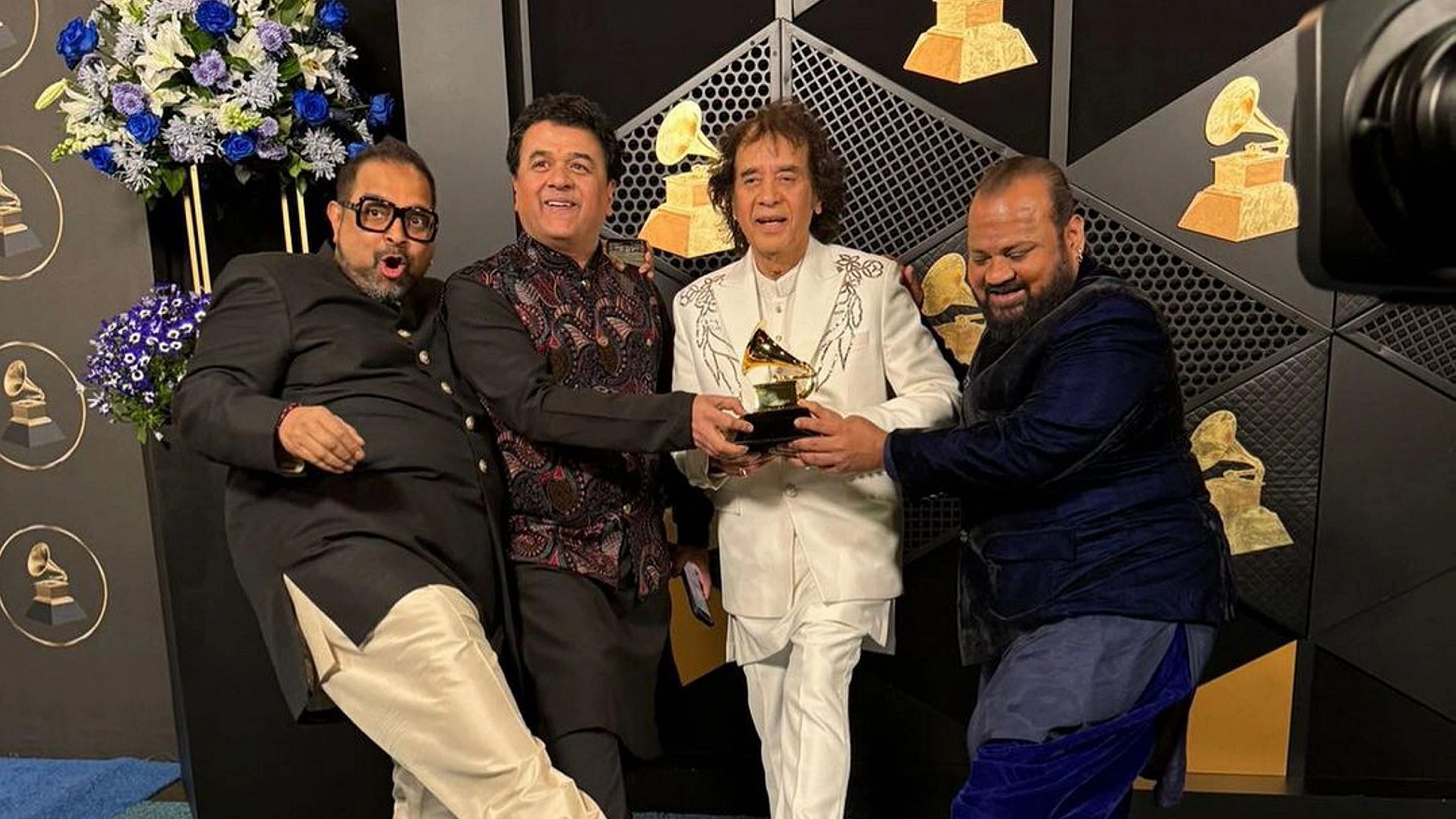 <div class="paragraphs"><p>Ustad Zakir Hussain, vocalist Shankar Mahadevan, percussionist V Selvaganesh and violinist Ganesh Rajagopalan of Shakti pose for photos with the award for best global music album for 'This Moment' during the 66th annual Grammy Awards, in Los Angeles, USA.</p></div>