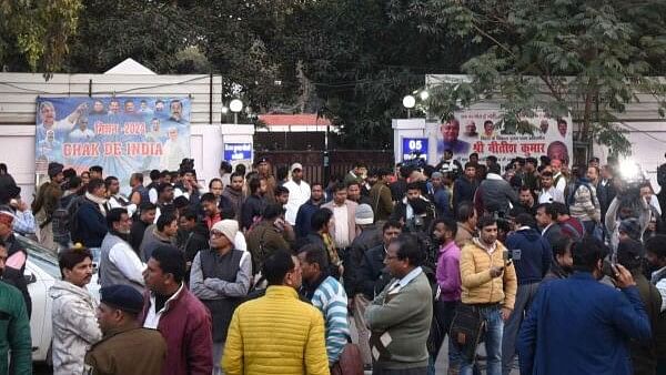 <div class="paragraphs"><p>Crowd outside the residence of Bihar Minister Vijay Kumar Chaudhary during the JD(U) legislature meeting ahead of the floor test of Bihar CM Nitish Kumar-led government, in Patna, Sunday, Feb. 11, 2024.</p></div>