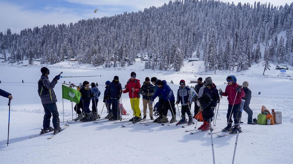 <div class="paragraphs"><p>Tourists skiing in Kashmir's Gulmarg.</p></div>