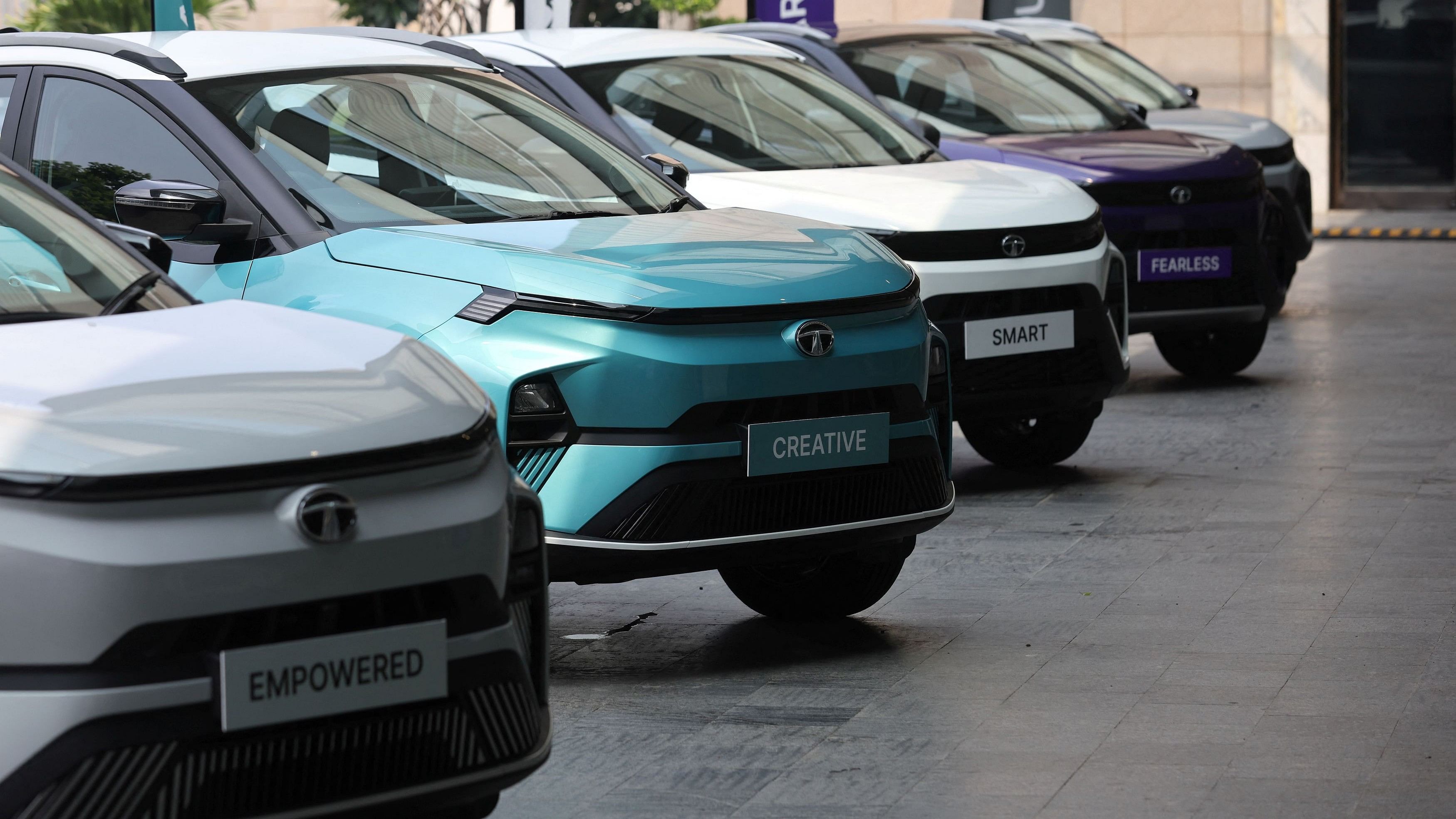 <div class="paragraphs"><p>Tata Motors' Nexon and Nexon.ev cars are seen parked for display outside a hotel ahead of its launch in New Delhi, September 14, 2023.</p></div>