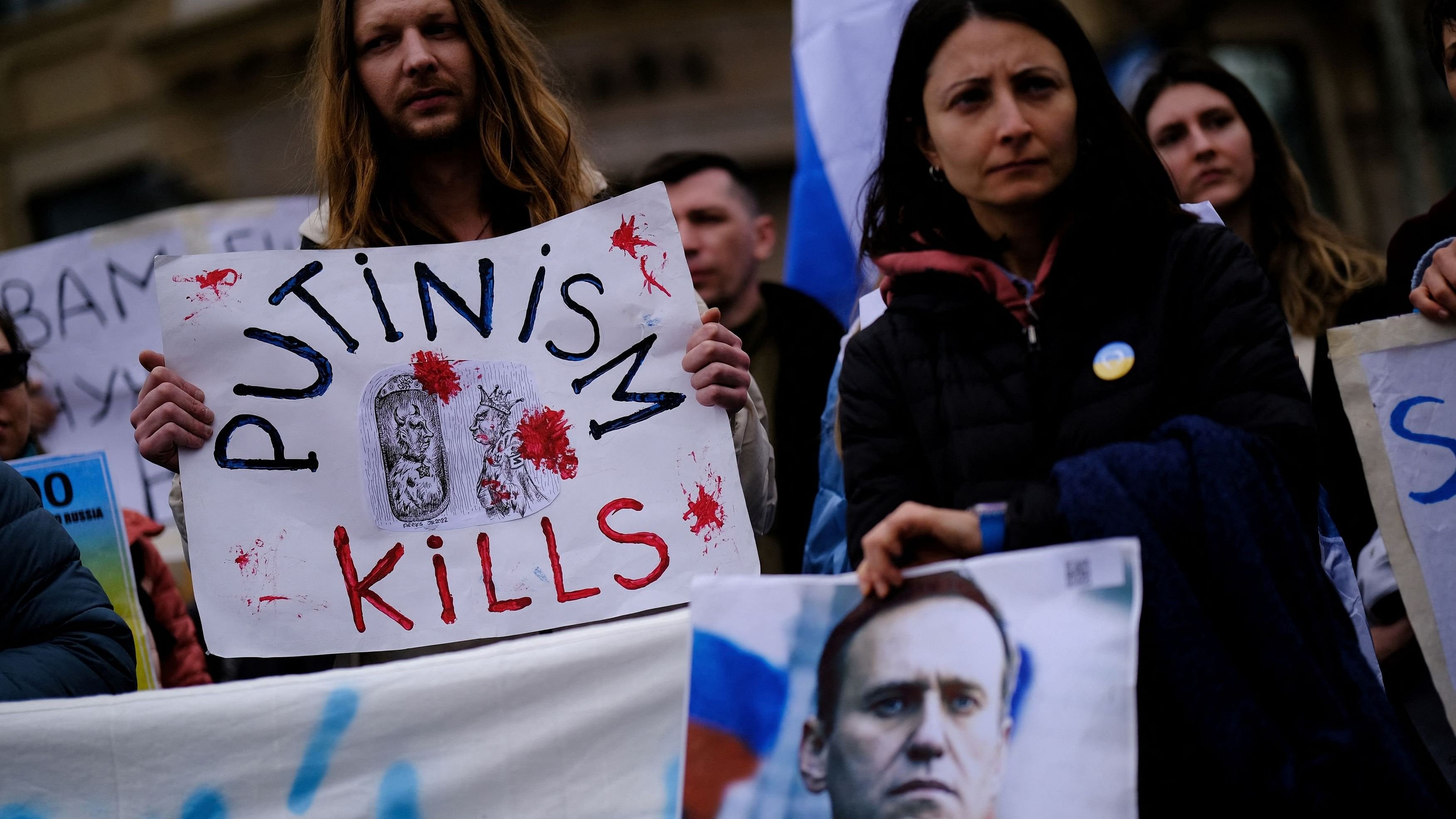 <div class="paragraphs"><p>People hold a banner and an image of late Russian opposition leader Alexei Navalny, in Barcelona, Spain, February 25, 2024. </p></div>