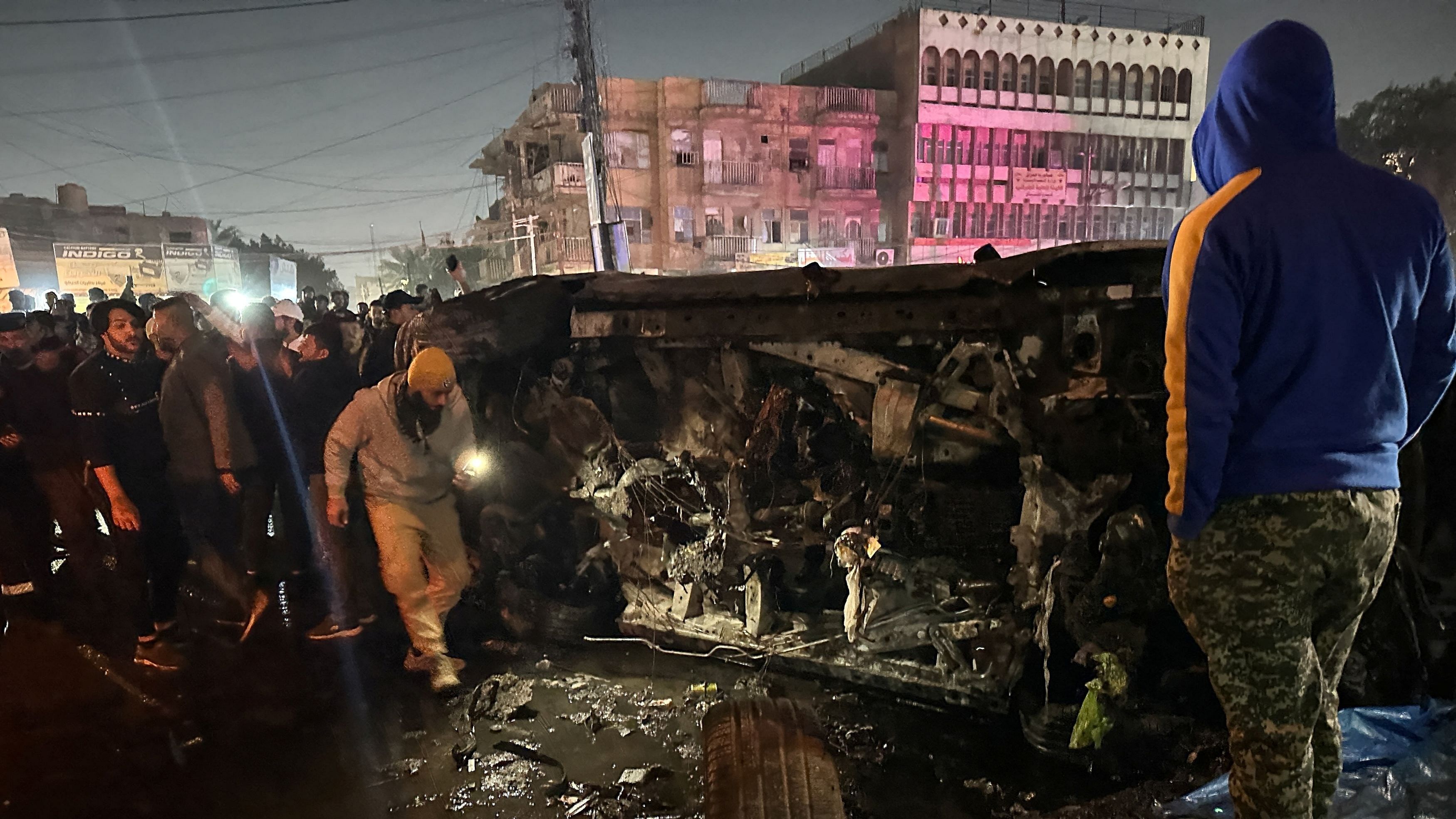 <div class="paragraphs"><p>People inspect a vehicle, after what security sources said was a deadly drone strike, in Baghdad, Iraq, February 7, 2024. </p></div>