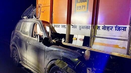 <div class="paragraphs"><p> A car rams into a truck on the Bharatmala road near Rasisar, Nokha, in Bikaner, early Friday, Feb. 16, 2024.</p></div>