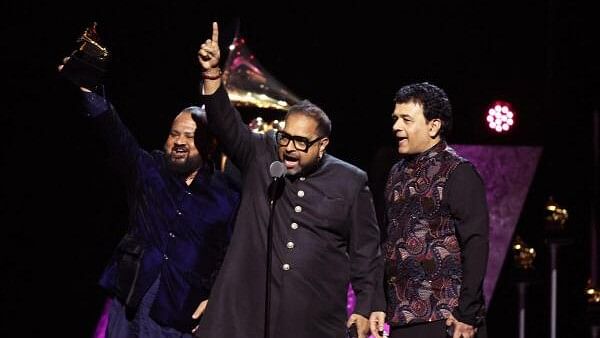 <div class="paragraphs"><p>Shakti accepts the award for Best Global Music Album for This Moment during the Premiere ceremony of the 66th Annual Grammy Awards in Los Angeles, California, US, Feb 4, 2024.</p></div>