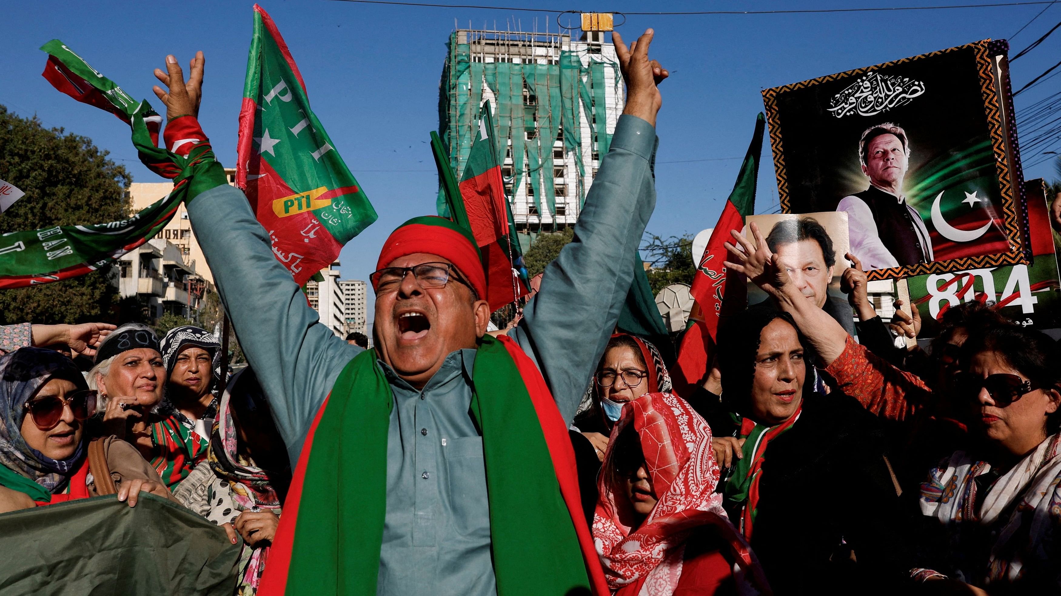<div class="paragraphs"><p>A file photo of supporters of Pakistan's Tehreek-e-Insaf (PTI) party demanding free and fair results of the elections, outside the provincial election commission office in Karachi.</p></div>