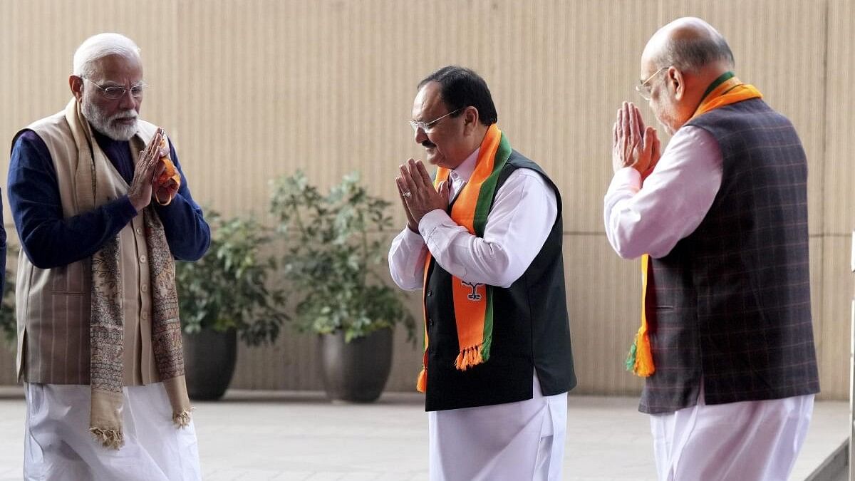 <div class="paragraphs"><p>Prime Minister Narendra Modi being received by BJP President J P Nadda and Union Home Minister Amit Shah.</p></div>