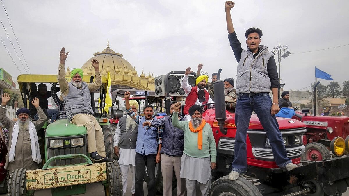 <div class="paragraphs"><p>Farmers rasie slogans during a tractor rally taken out in support of the farmers' 'Delhi Chalo' protest, in Amritsar, Monday, Feb. 26, 2024.</p></div>